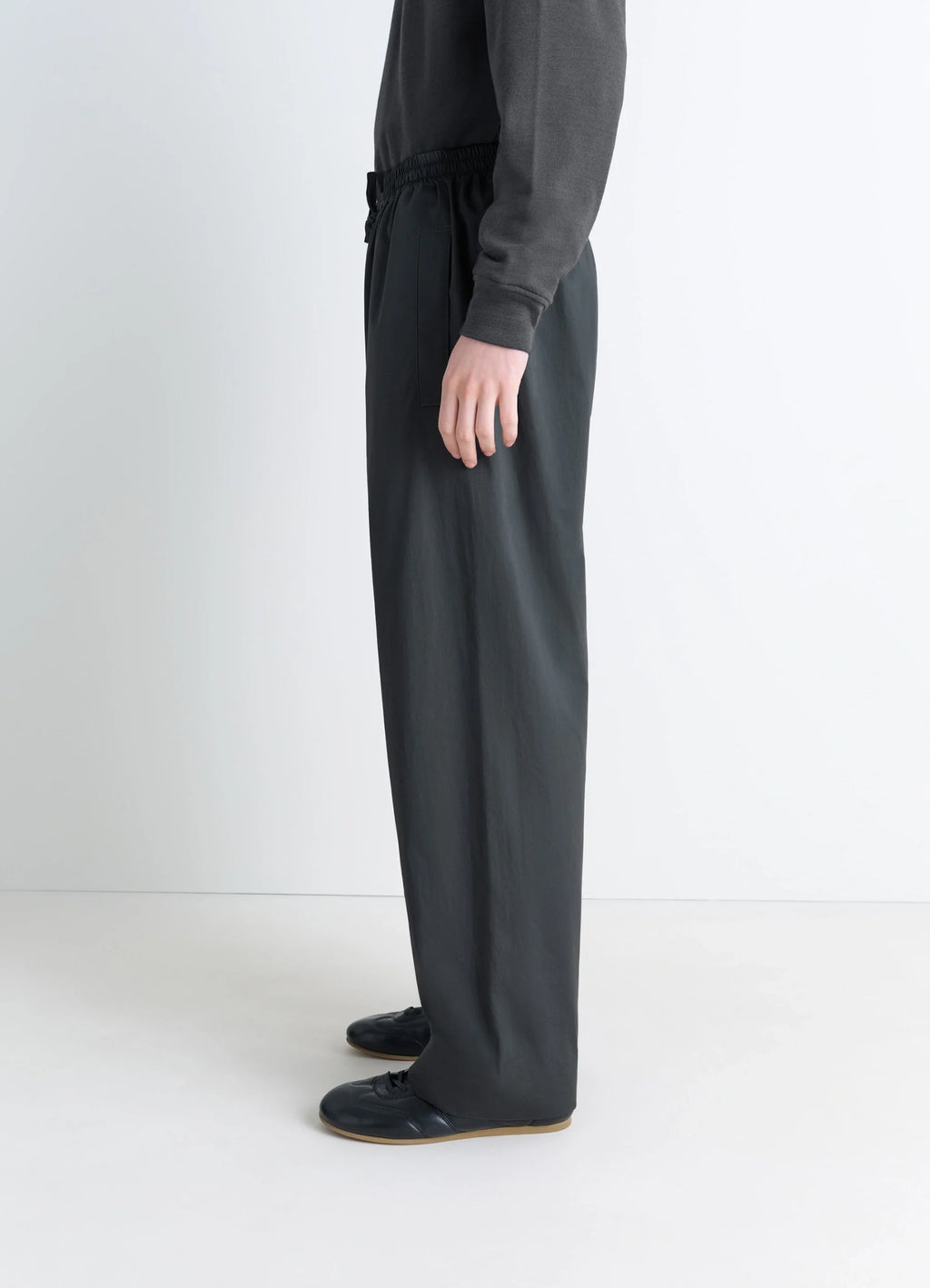 Lemaire Pyjama Pants in Garment Dyed Satin, model shot, profile view straight leg silhouette