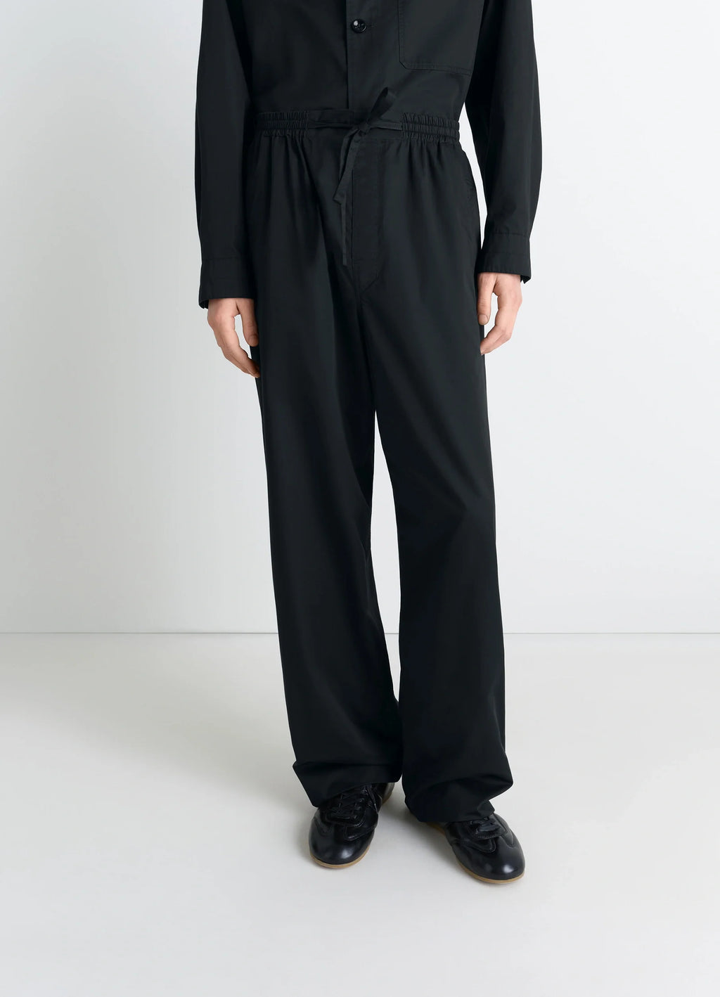 Lemaire Pyjama Pants in Black Cotton Satin, model shot, mid-body front view drawstring waistband