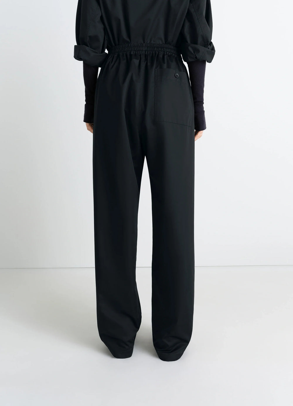 Lemaire Pyjama Pants in Black Cotton Satin, model shot, back view elastic waistband, single back pock
