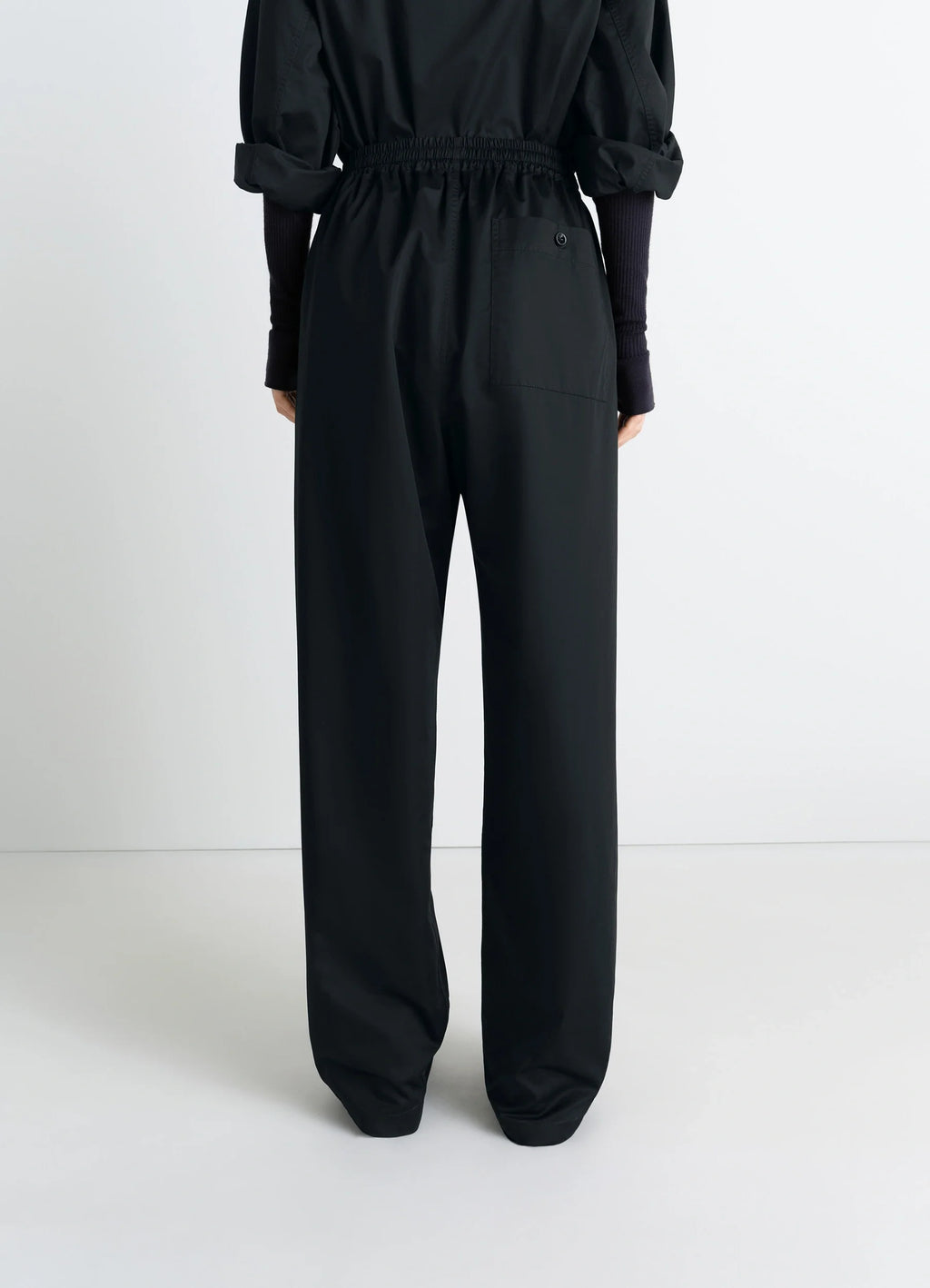 Lemaire Pyjama Pants in Black Cotton Satin, model shot, back view elastic waistband, single back pock