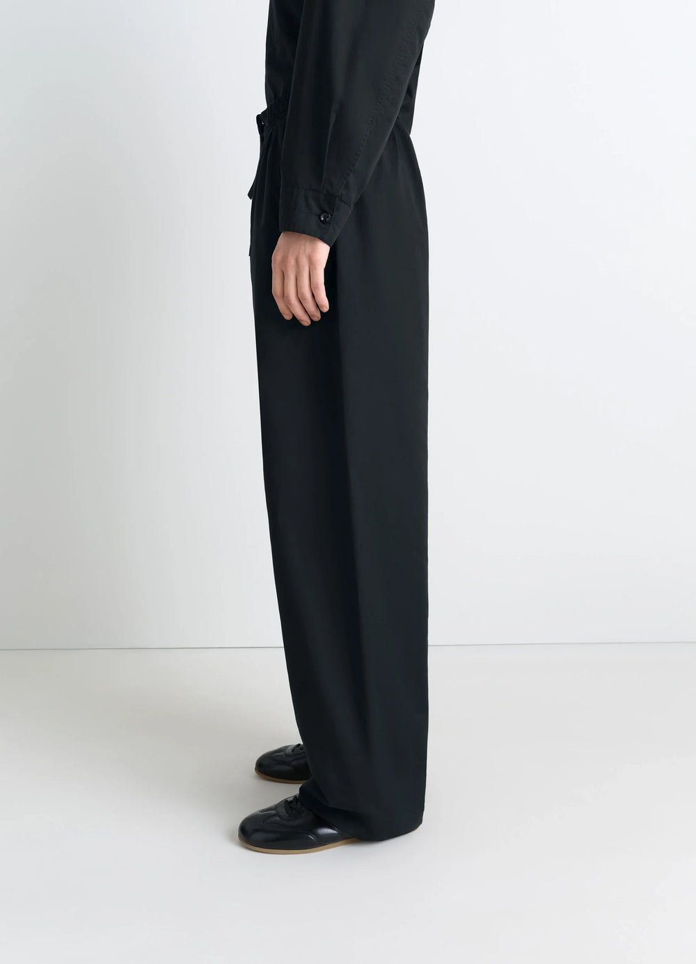 Lemaire Pyjama Pants in Black Cotton Satin, model shot, side view loose fit side leg