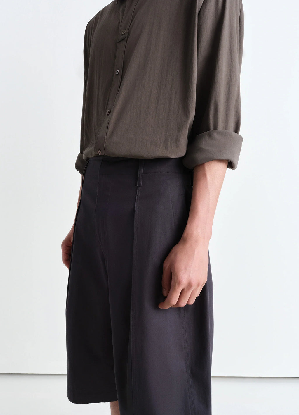 Lemaire Maxi Pleated Bermuda in Grey compact cotton twill, model shot, side detail pleated high waist