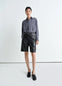 Lemaire Leather Shorts in Mat Black Leather, model shot, front view slightly flared knee-length