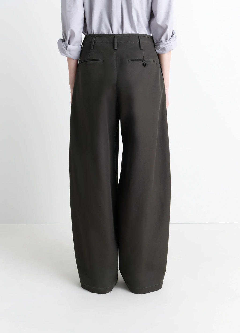 Lemaire Large Chino Pants in Dark Olive Cotton Twill, model shot, back view belt loops, rear welt pockets