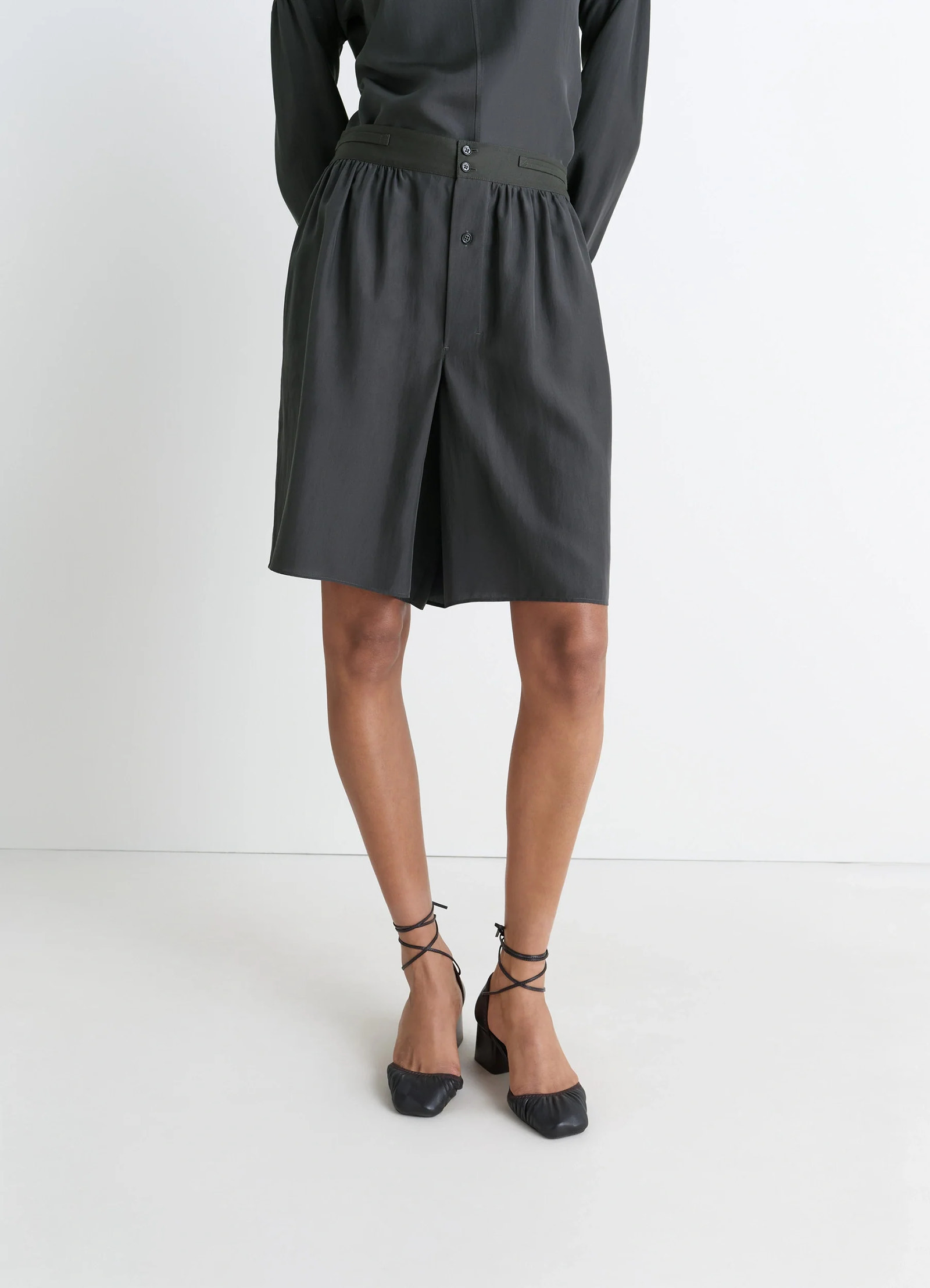 Lemaire soft shorts in silk pongee, model shot, side view pleated front style