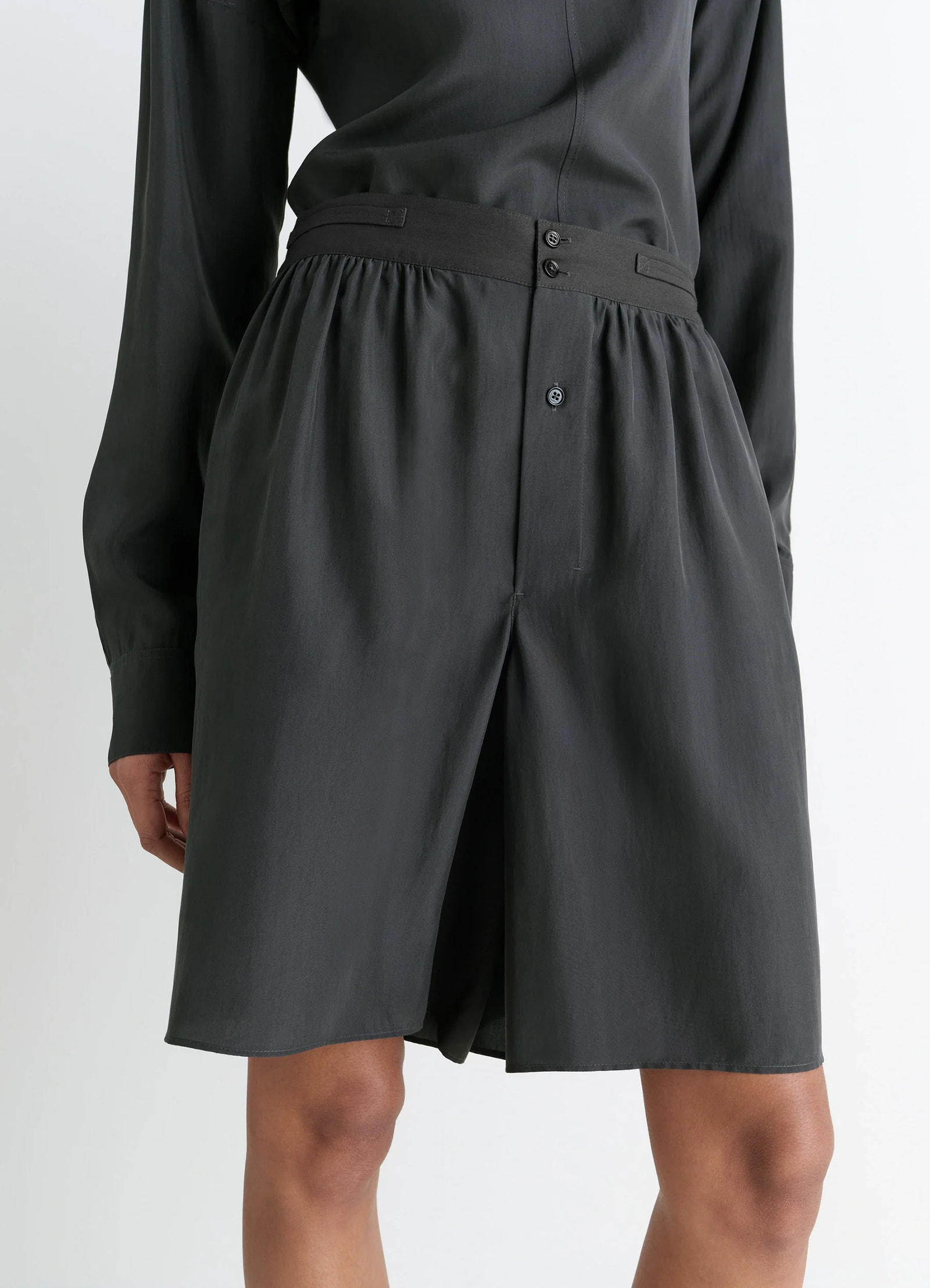 Lemaire soft shorts in silk pongee, model shot, close-up detail shot gathered waistband, buttoned