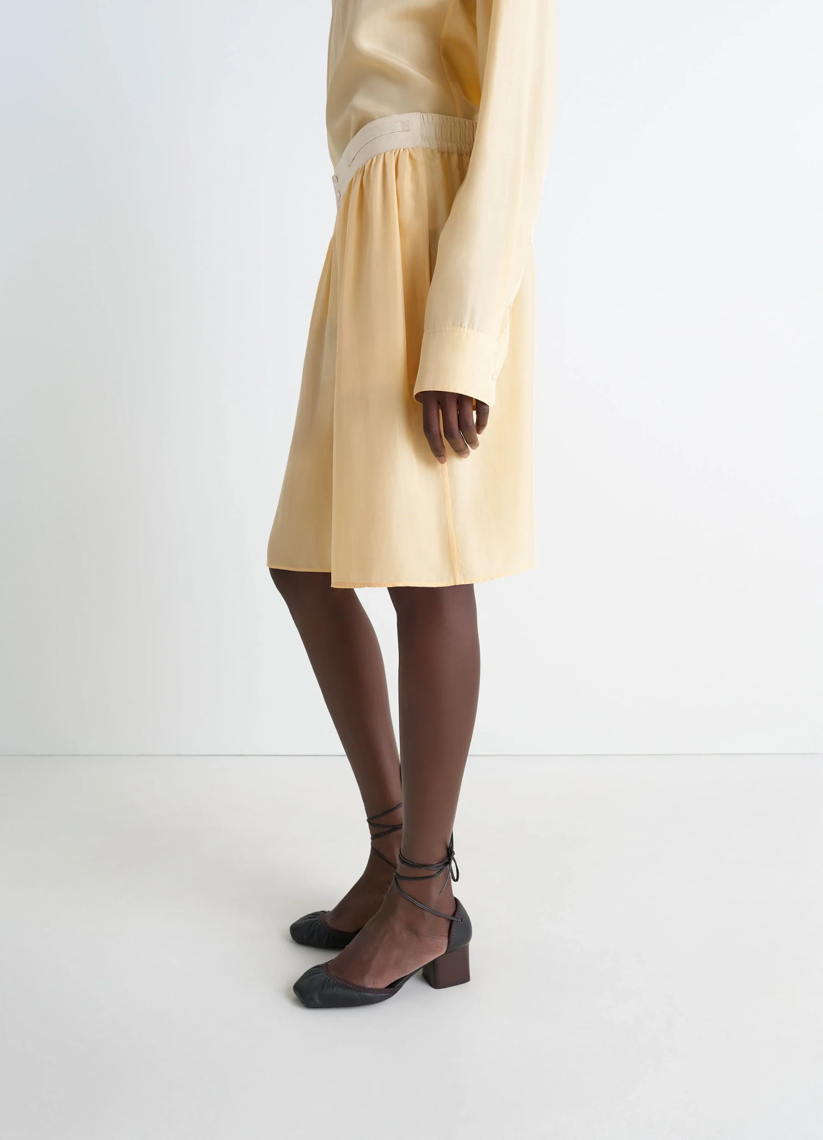 Lemaire soft shorts in silk pongee, model shot, side view mid-length loose fit