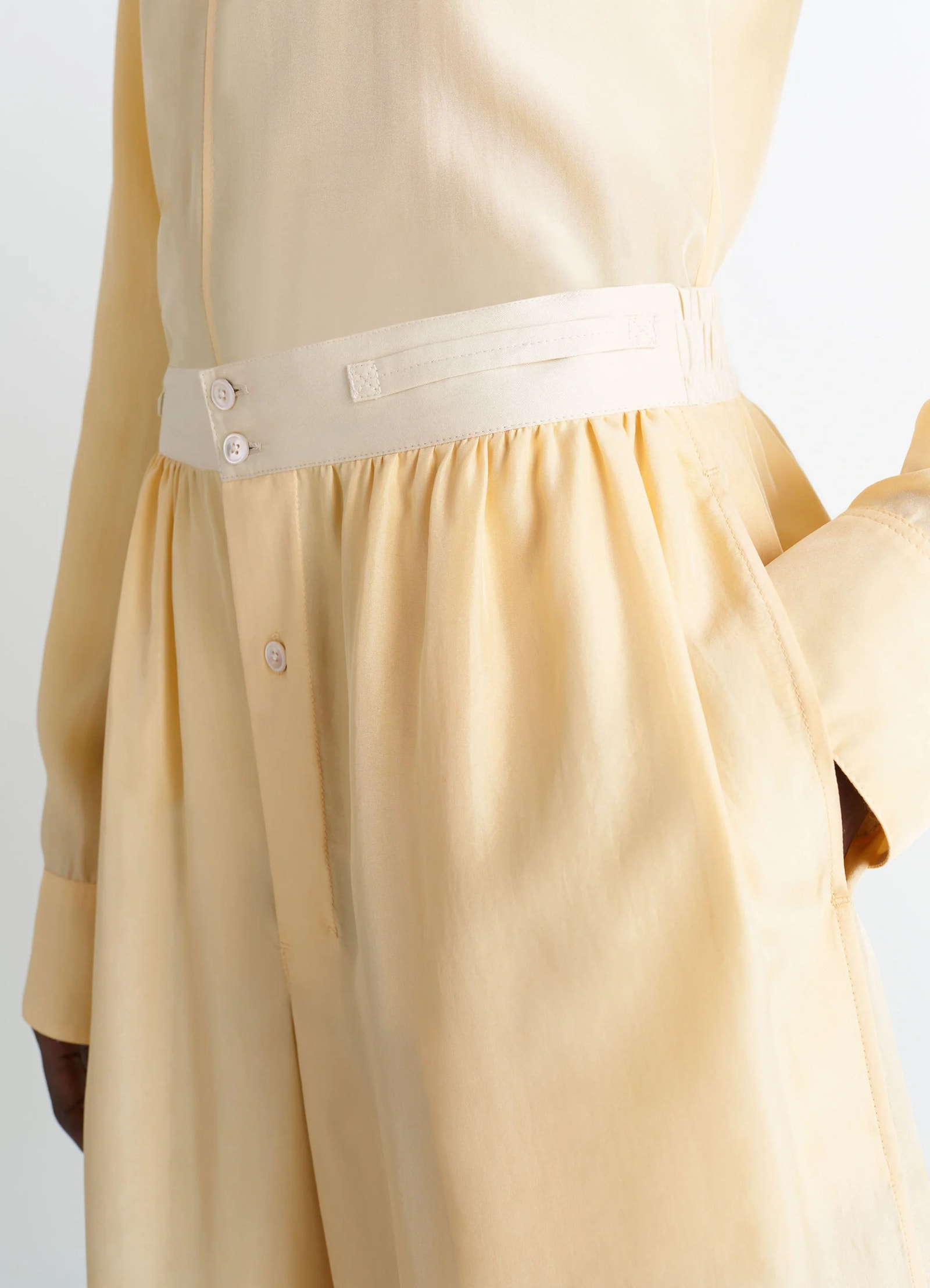 Lemaire soft shorts in silk pongee, model shot, waist detail buttoned waistband, draped look