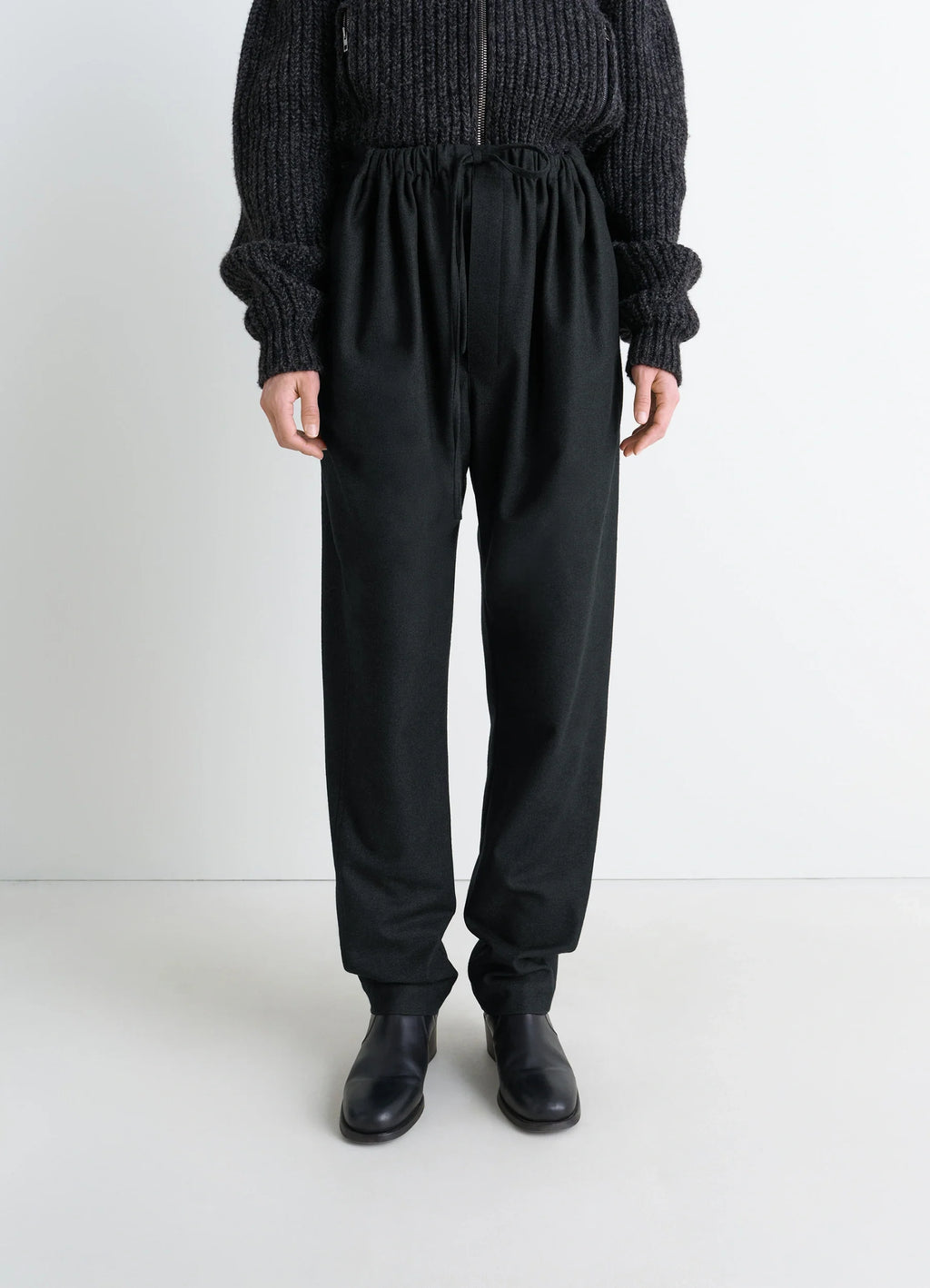 Lemaire Drawstring Pants in Black Cashmere-blend, model shot, full body front view high waist with drawstring