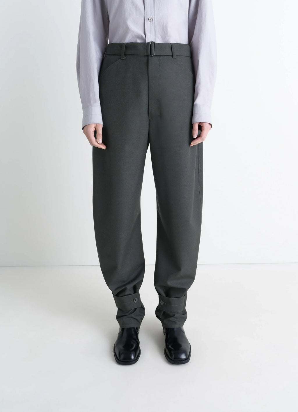 Lemaire Curved Tailored Pants in Tropical Wool Blend, model shot, front detail cropped buttoned cuff