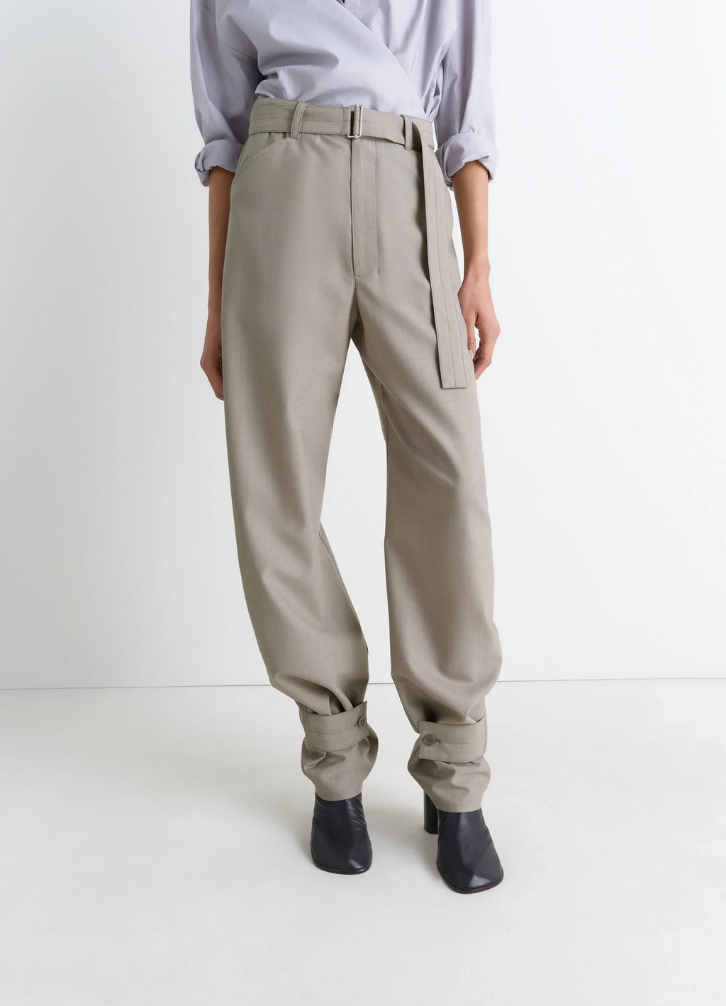 Lemaire Curved Tailored Pants in Tropical Wool Blend, model shot, side view belted cuffed hems