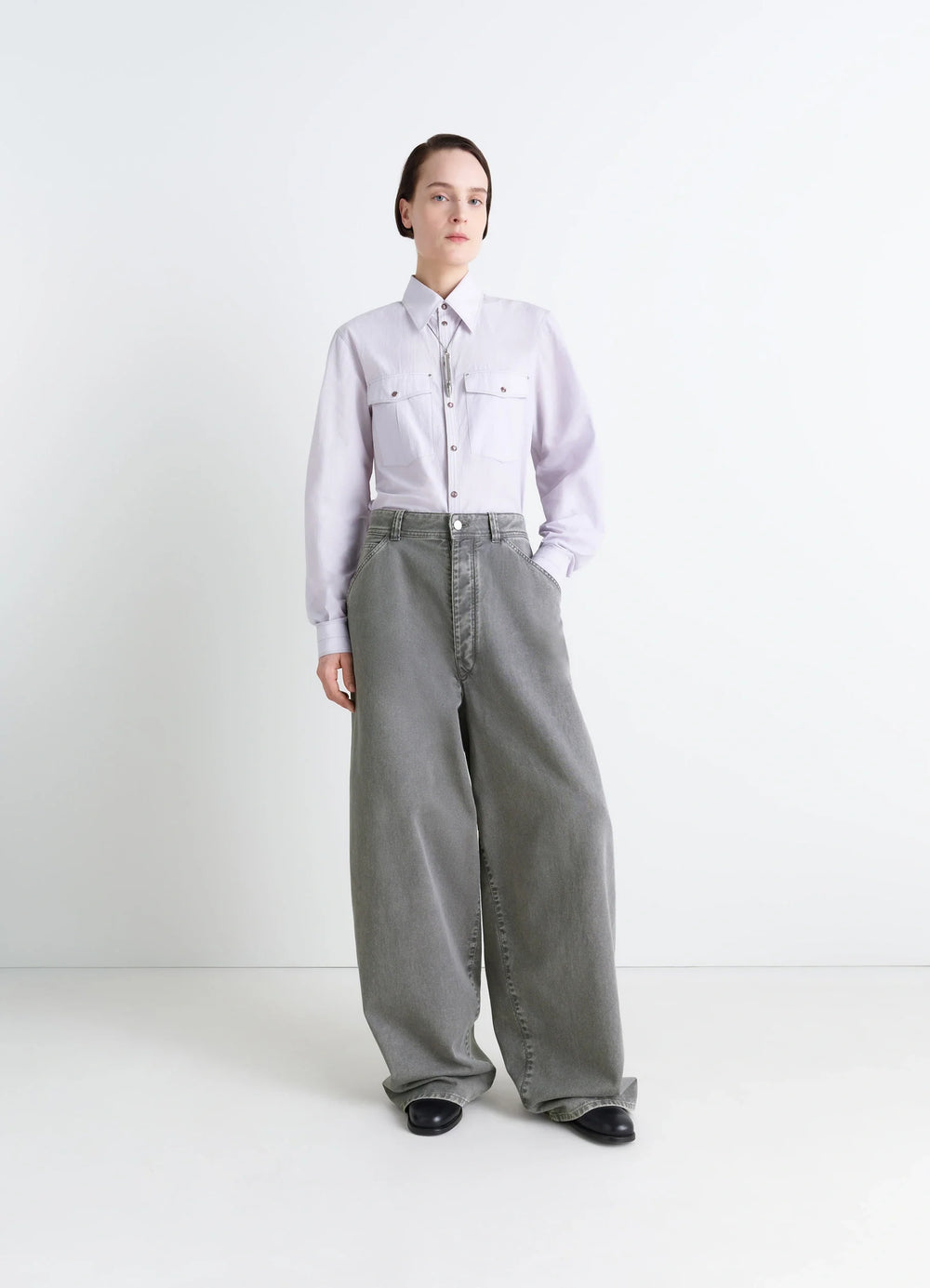 Lemaire Wide Leg Pants in Snow Garment Dyed Denim, model shot, front view wide leg, relaxed fit