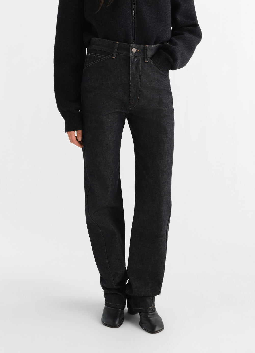 Five pockets twisted slate denim pants LEMAIRE worn by model front view with black shoes and sweater