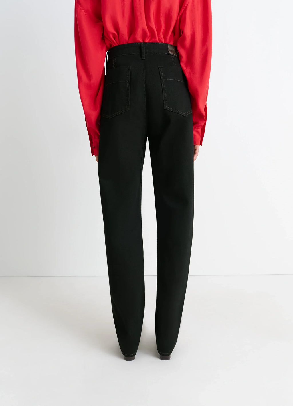 Lemaire Five Pockets Twisted Pants in Deep Black Wash Thick Denim, model shot, back view full length classic high waist pocke