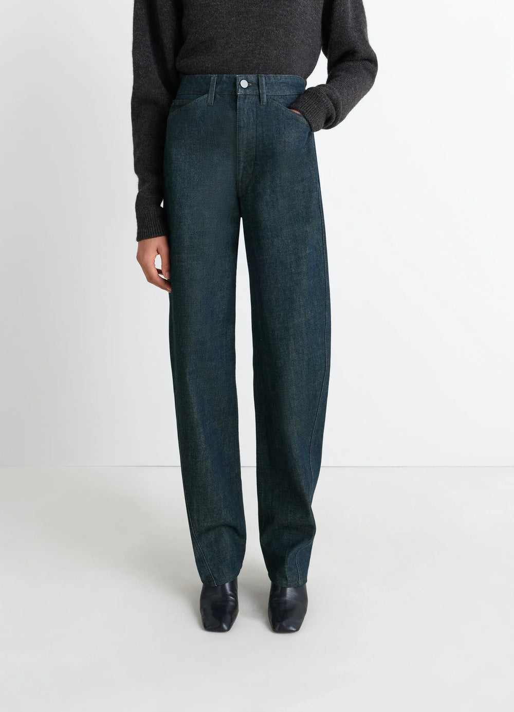 Lemaire Five Pockets Twisted Pants in Deep Indigo Thick Denim, model shot, three-quarter view high waist tailored cut