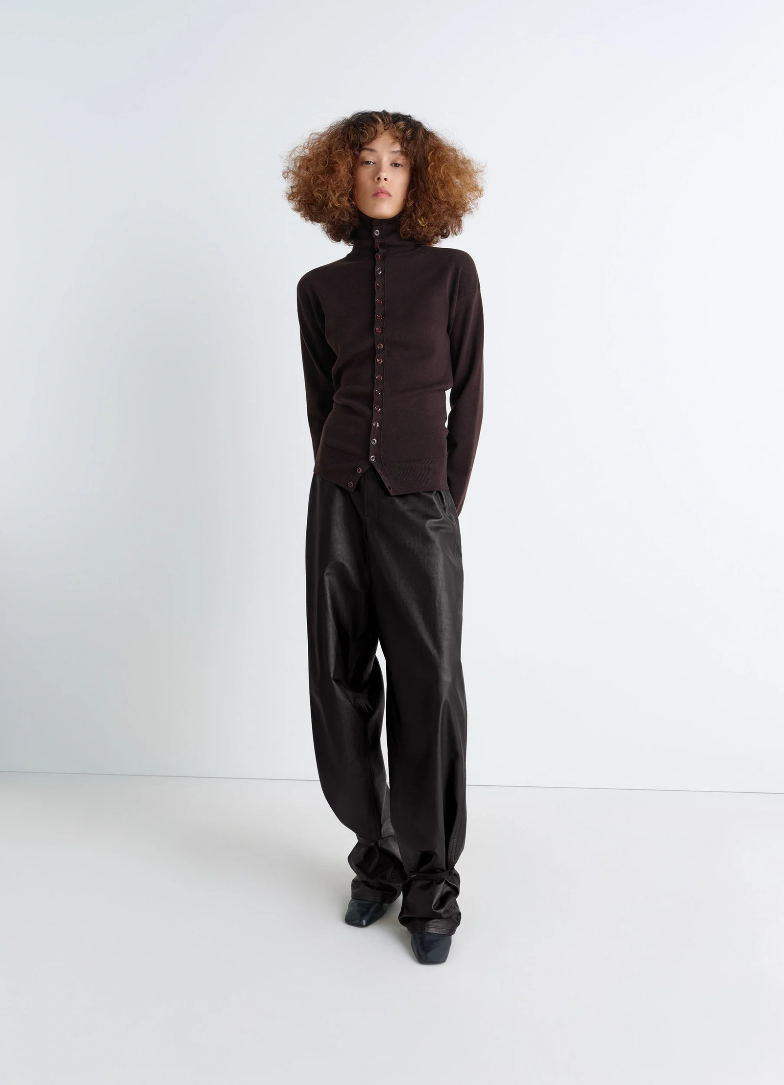 Lemaire soft leather pants in cow leather with natural shine, model shot, front view adjustable bottom