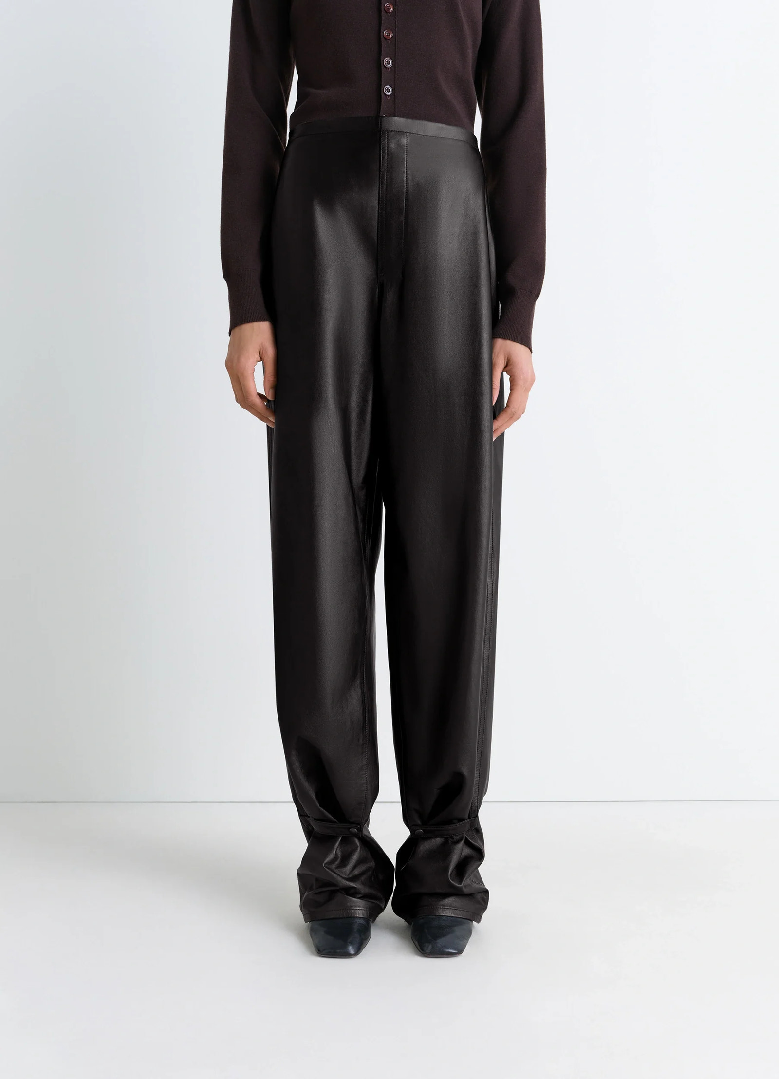 Lemaire soft leather pants in cow leather with natural shine, model shot, full-length front view high-rise relaxed cut