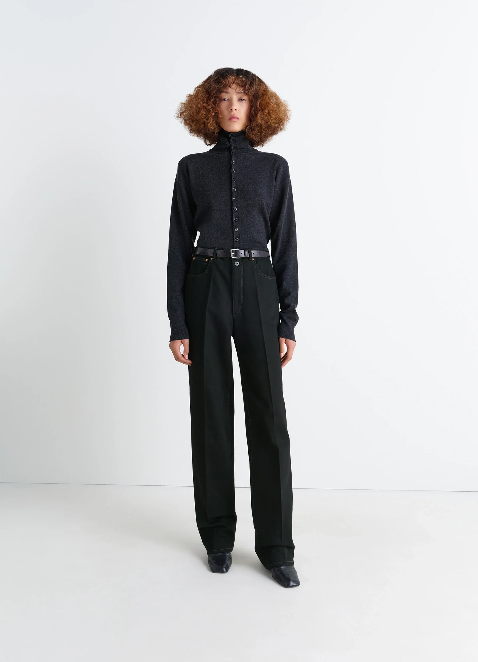 Lemaire high waisted straight pants in deep black thick denim, model shot, front view straight cut with pleats
