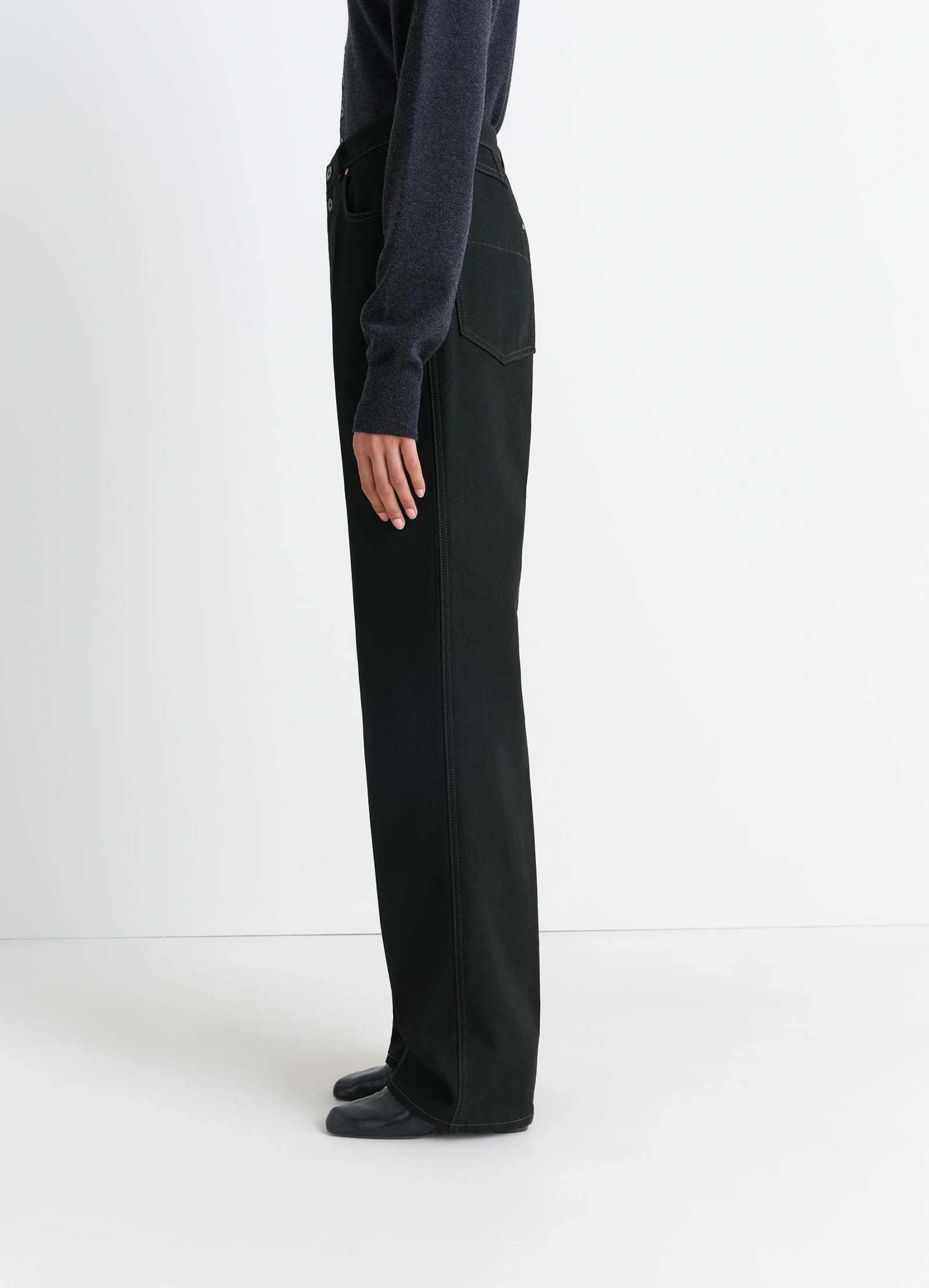 Lemaire high waisted straight pants in deep black thick denim, model shot, side view high waist straight cut