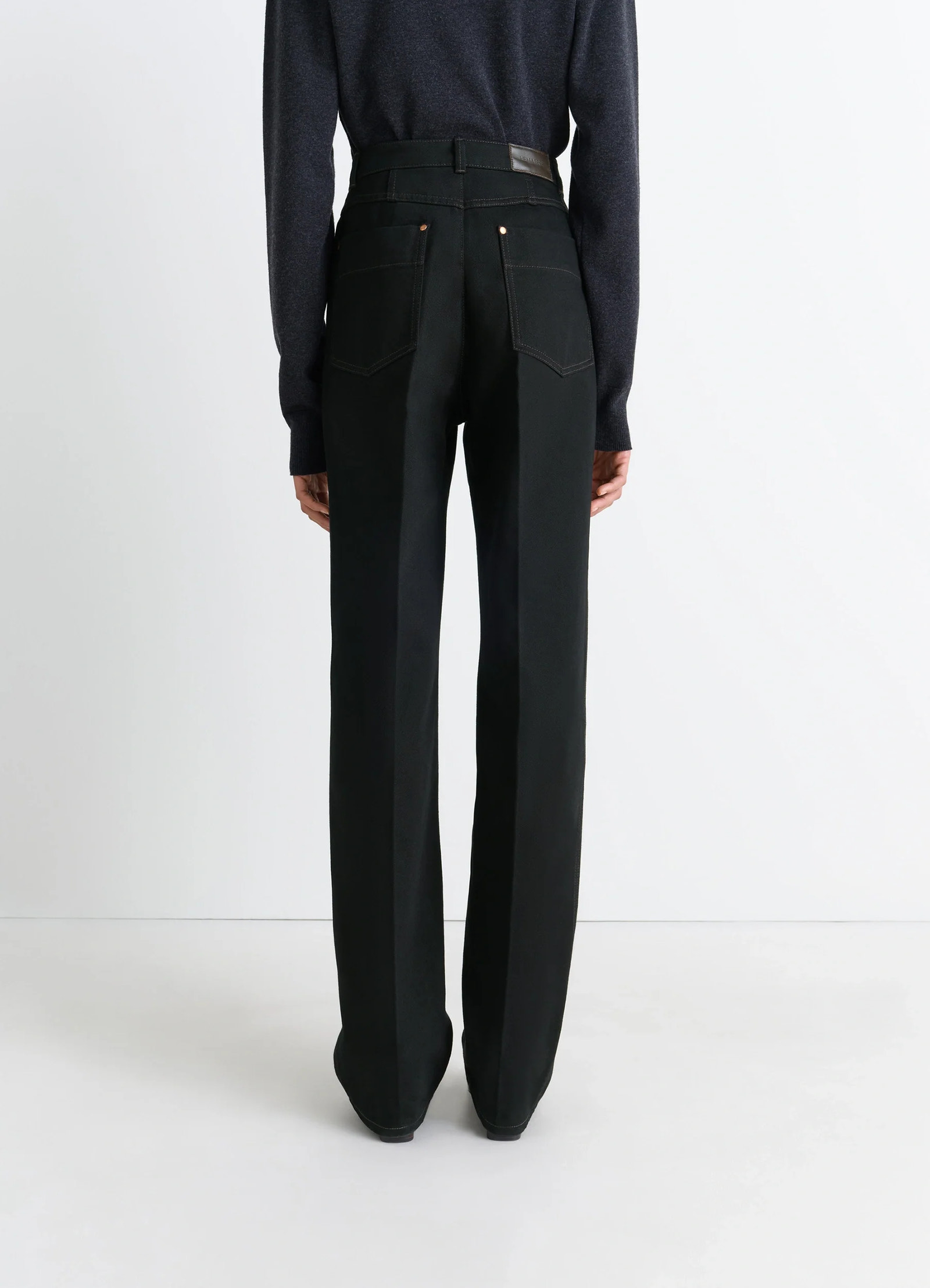 Lemaire high waisted straight pants in deep black thick denim, model shot, back view wide leg with pockets