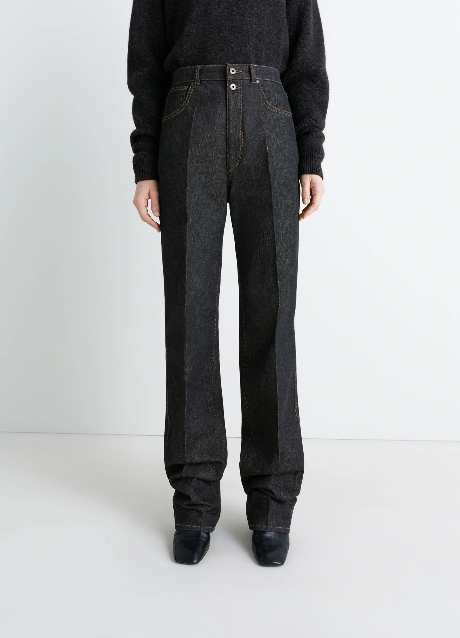Lemaire high waisted straight pants in slate denim, model shot, three-quarter view stacked hem detail