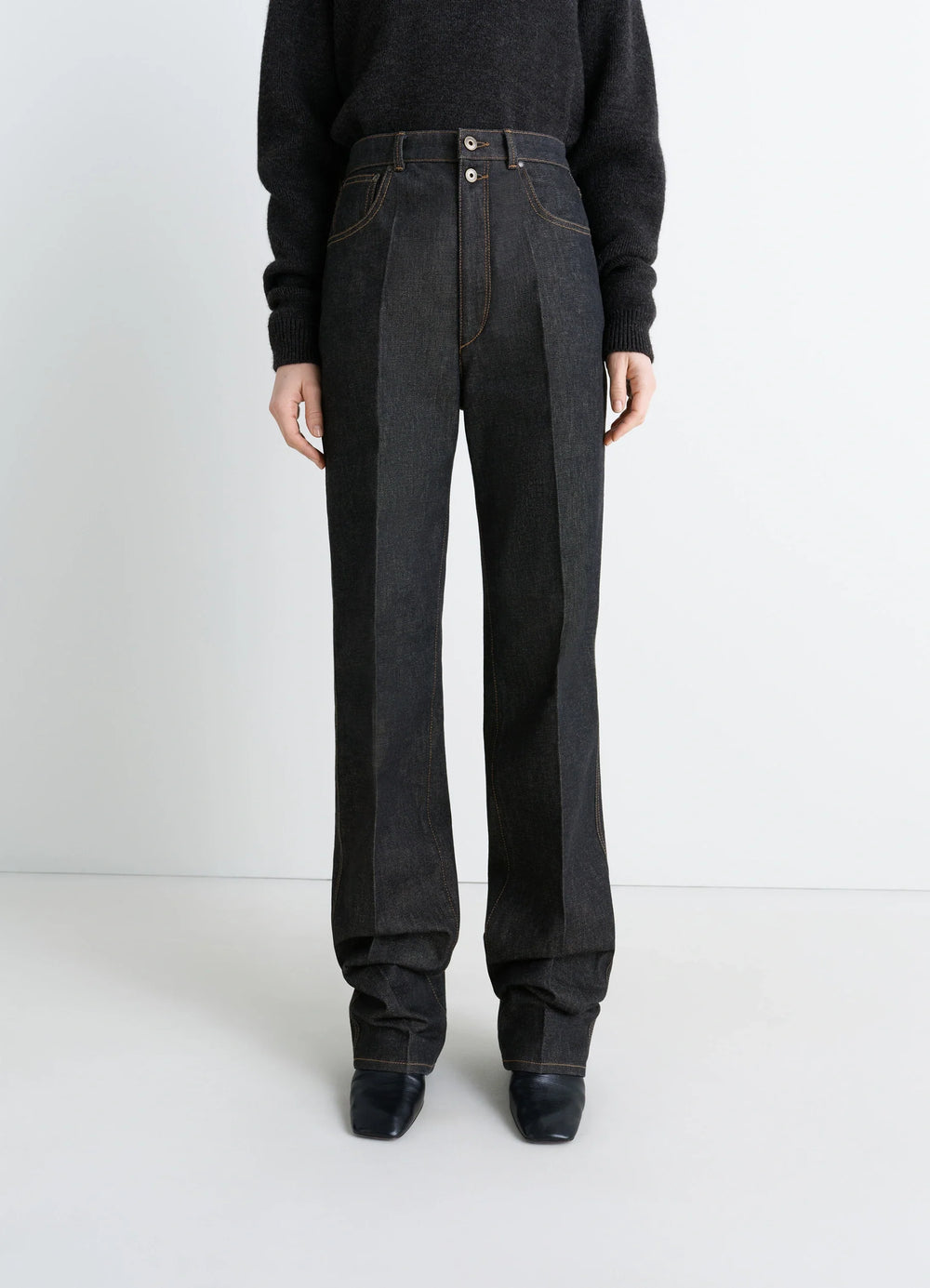 Lemaire High Waisted Straight Pants in Slate Denim, model shot, three-quarter view stacked hem detail