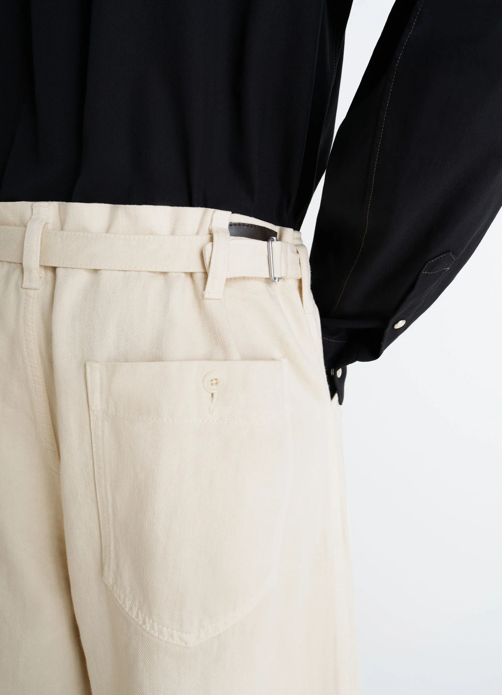 Lemaire maxi workwear pants in heather garment dyed denim, model shot, back detail shot belted high waist
