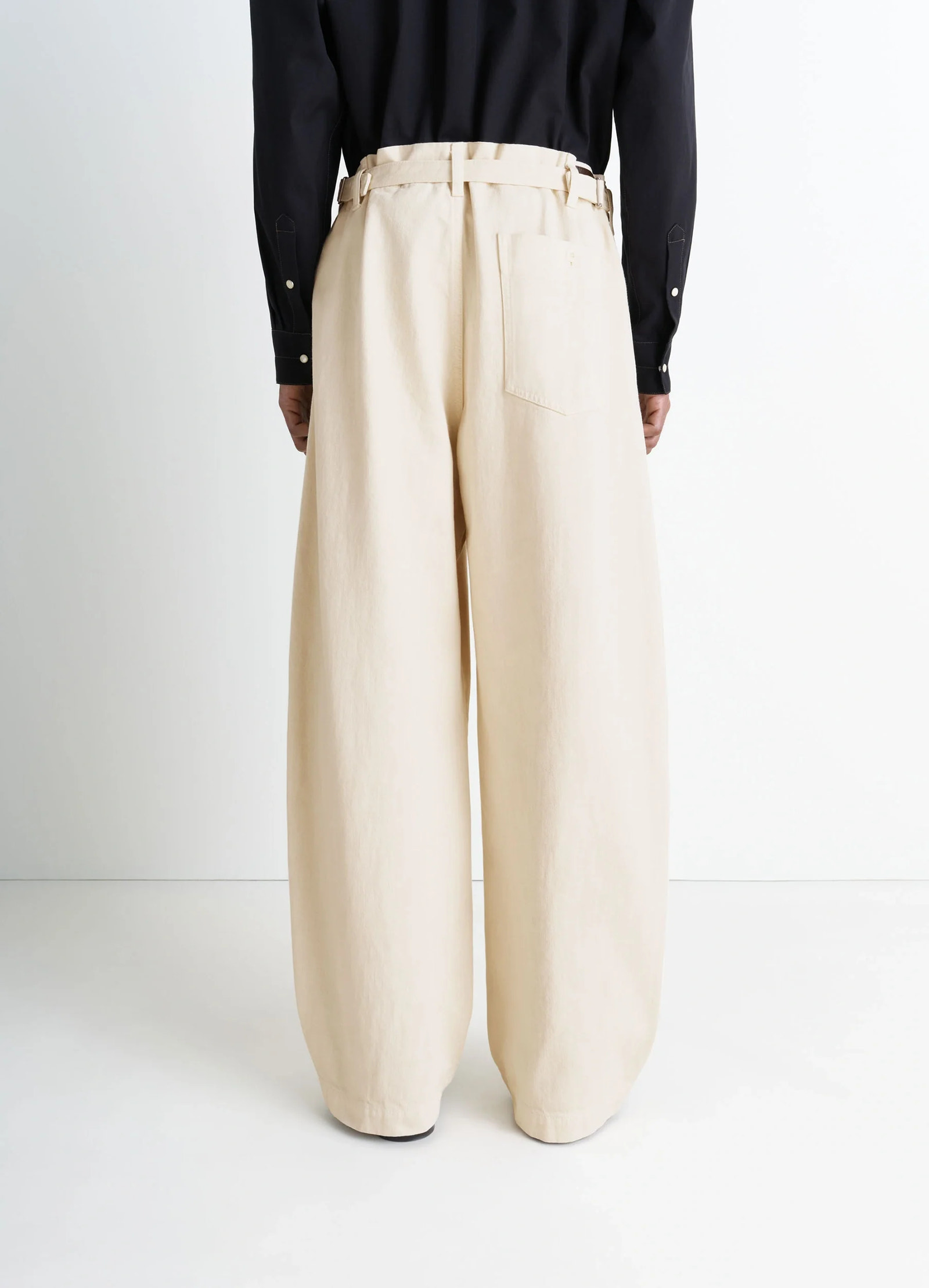Lemaire maxi workwear pants in heather garment dyed denim, model shot, back full body view wide leg relaxed fit