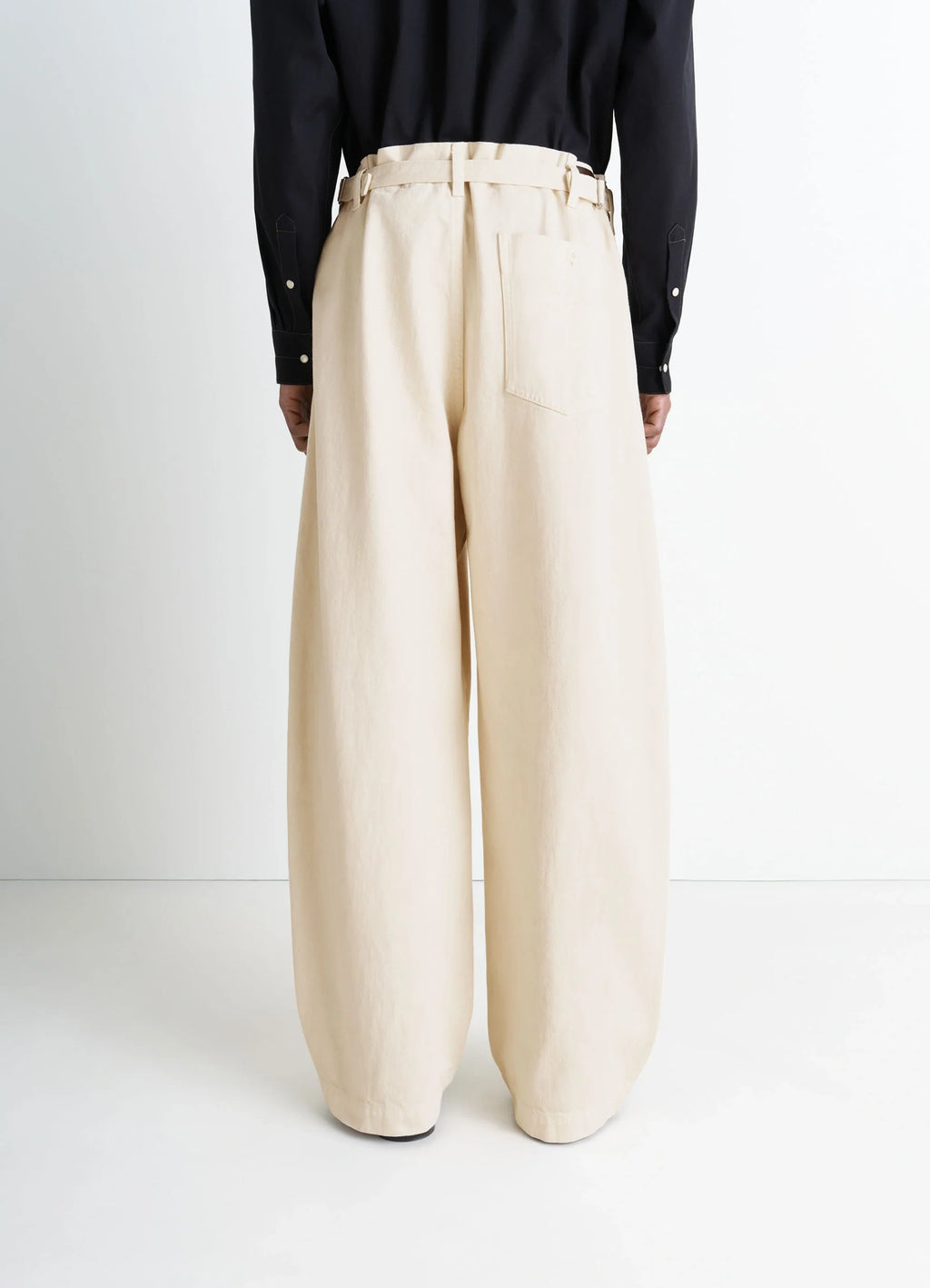 Lemaire Maxi Workwear Pants in Heather Garment Dyed Denim, model shot, back full body view wide leg relaxed fit