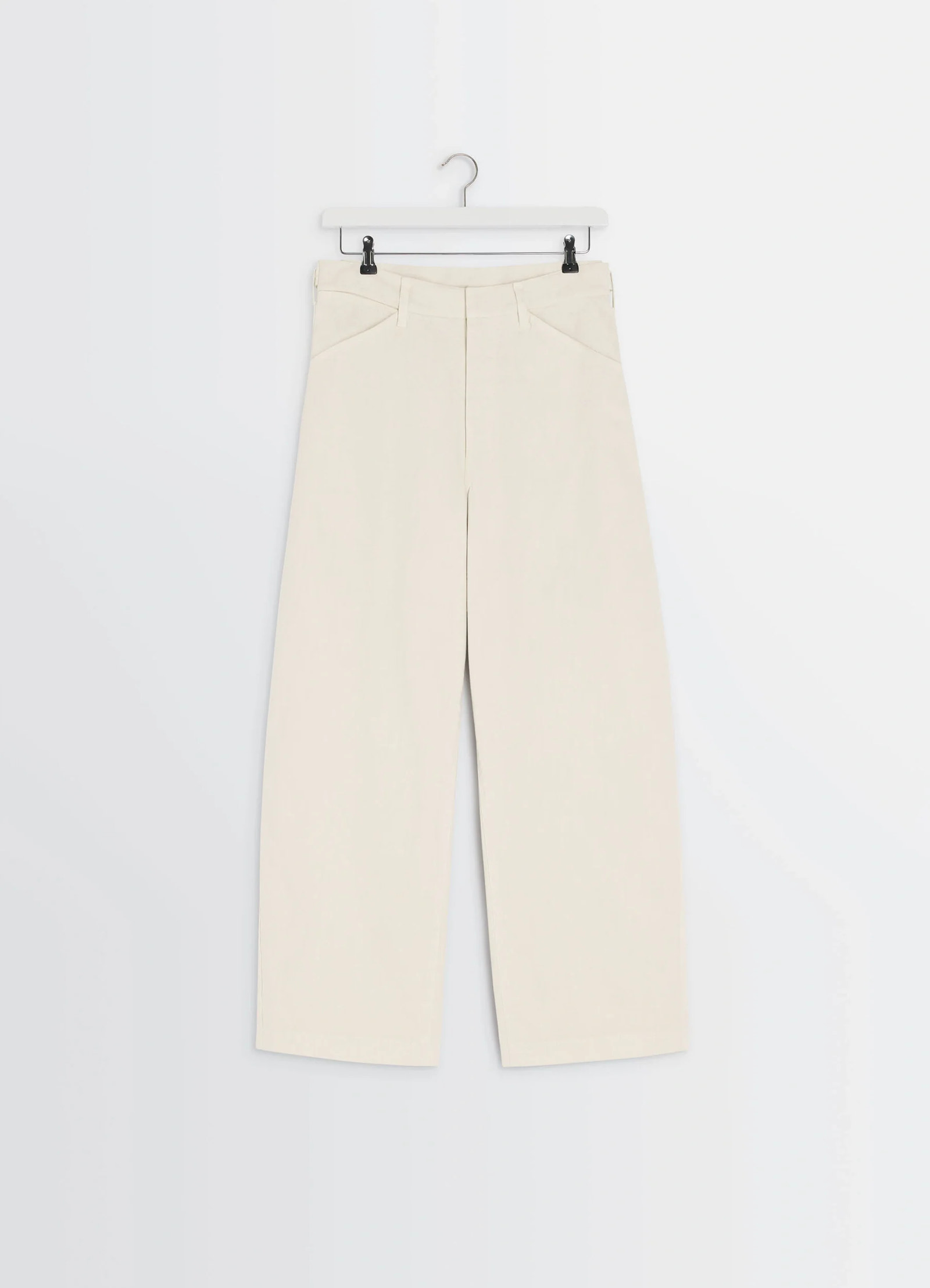 Lemaire maxi workwear pants in heather garment dyed denim, product shot, hanging front view straight wide leg hanging