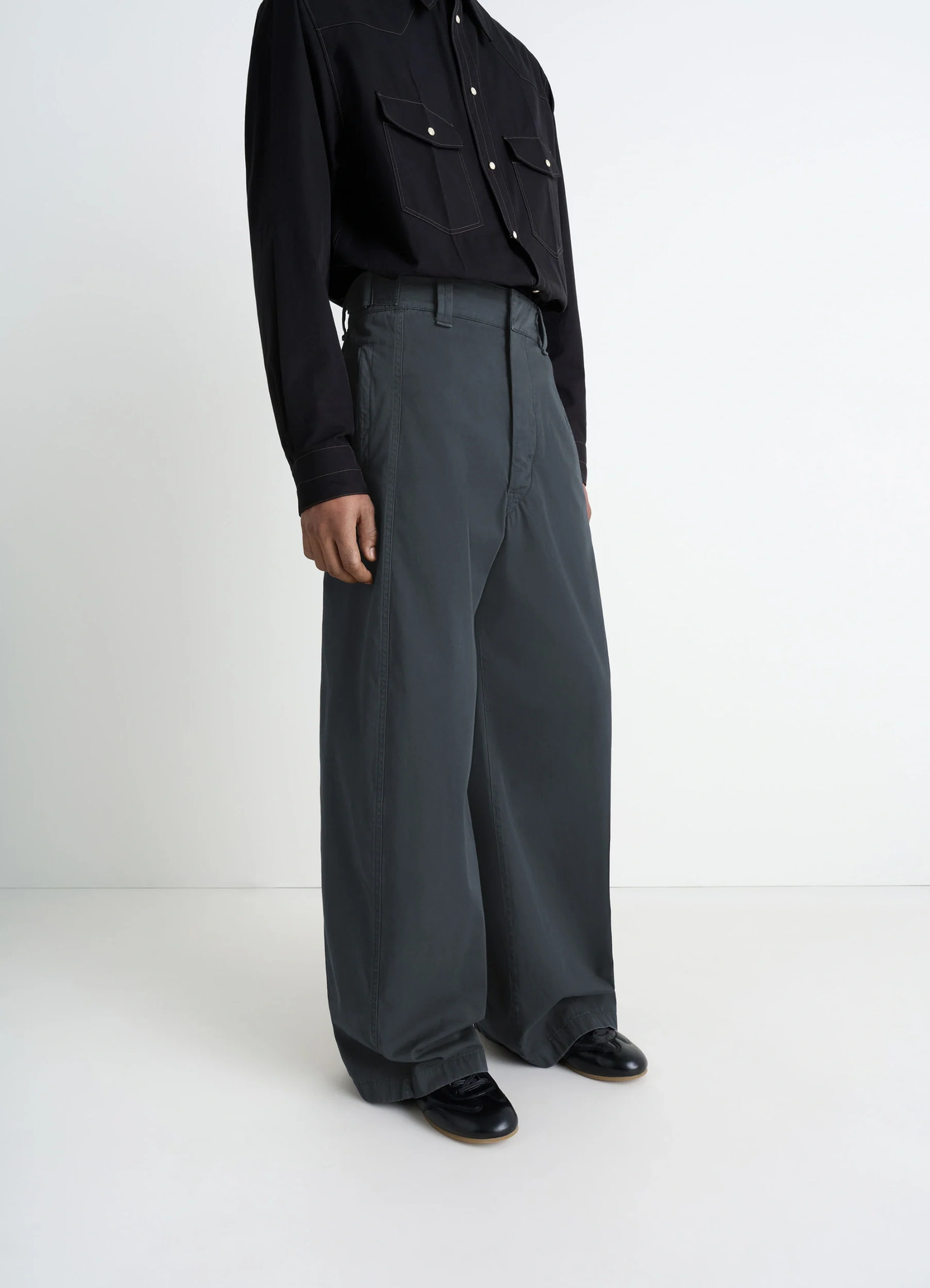 Maxi utility pants in garment dyed compact cotton twill, model shot, side view adjustable metal buckle tabs