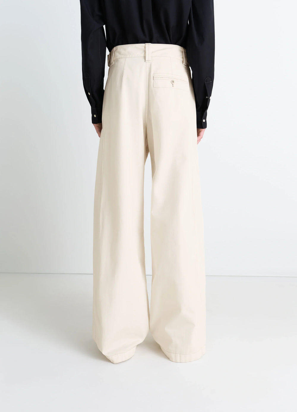 MAXI UTILITY PANTS in Garment Dyed compact cotton twill, model shot, rear three-quarter view wide leg high waist back pocket