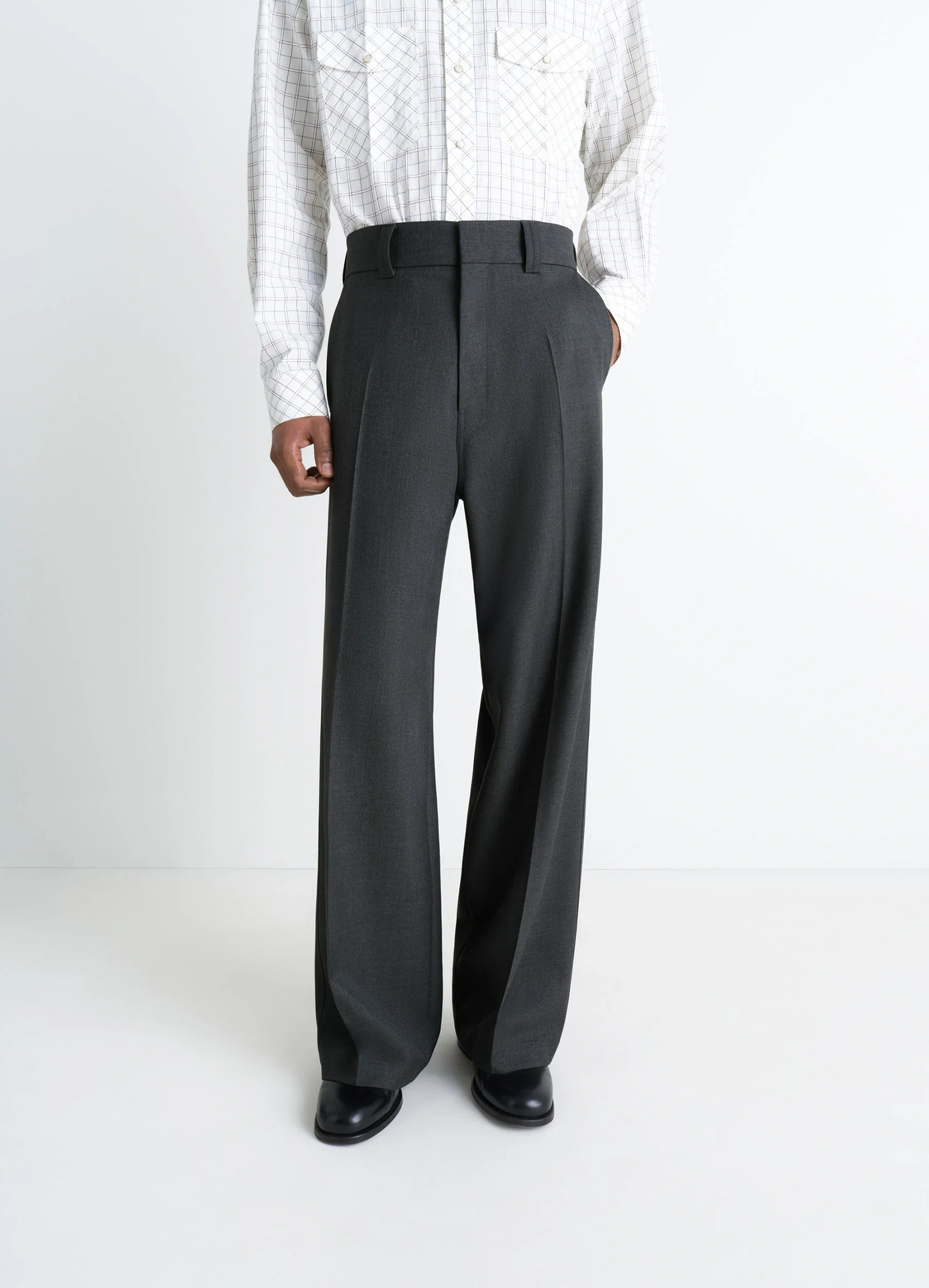 Lemaire straight tailored pants in grey wool-blend suit fabric, model shot, side view pleated side drape