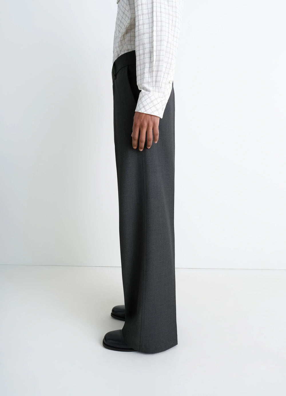 Lemaire Straight Tailored Pants in Grey Wool-Blend Suit Fabric, model shot, profile view wide leg hem detail