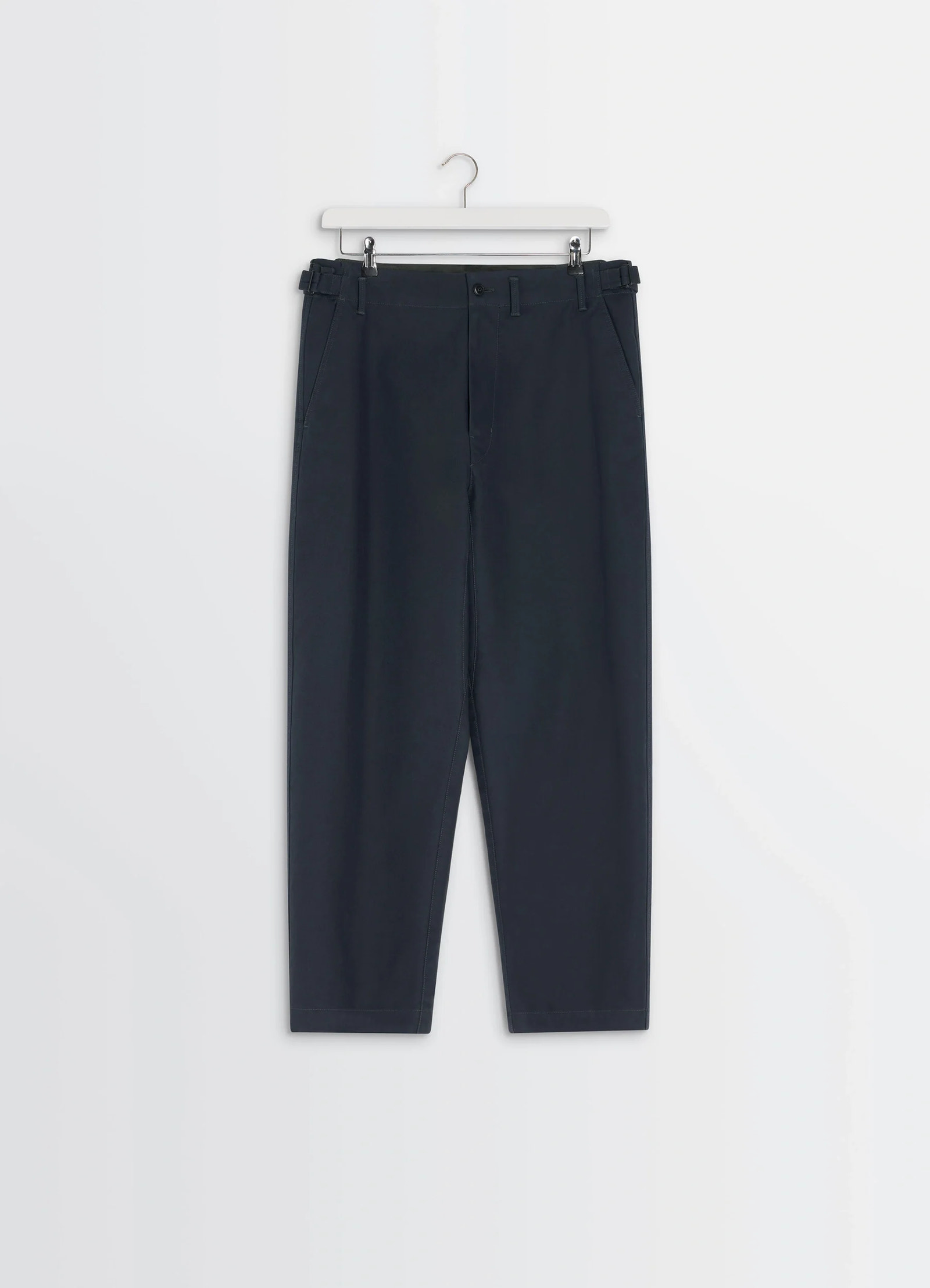 Lemaire carrot pants in thick cotton twill, product shot, hanging front view cuffed hem