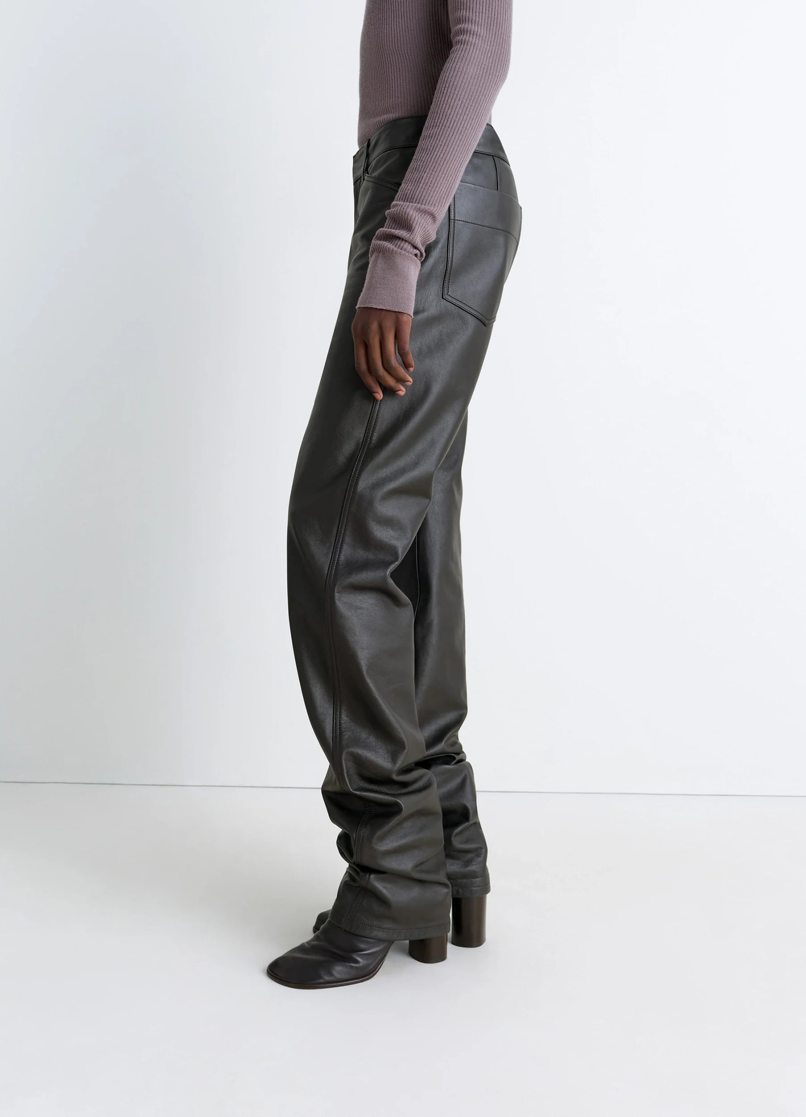 Lemaire leather five pockets twiste in nappa cow leather, model shot, side view slouchy fit over boots