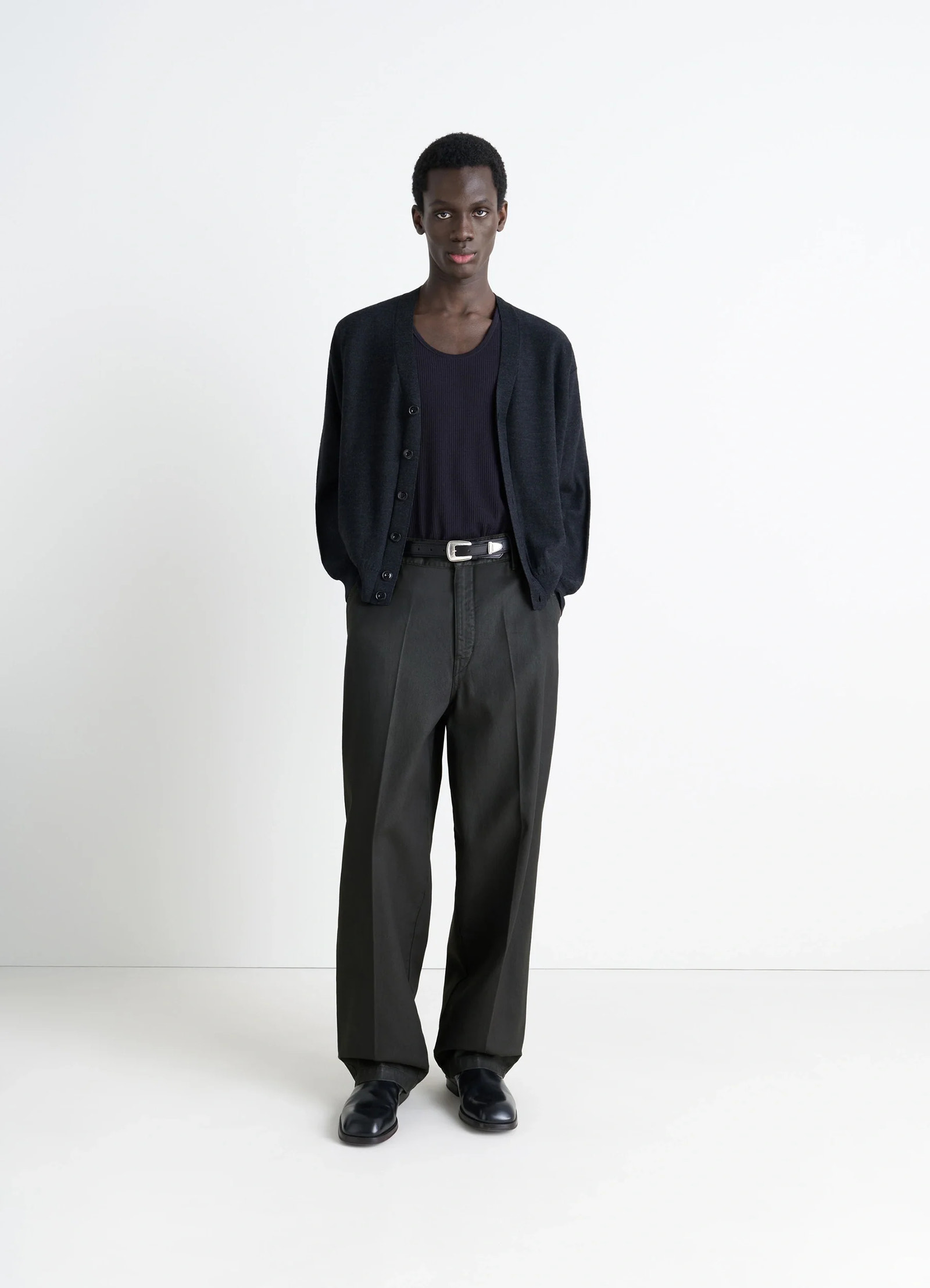 Lemaire maxi barrel workwear pants in glossy coated denim, model shot, front view oversized barrel cut