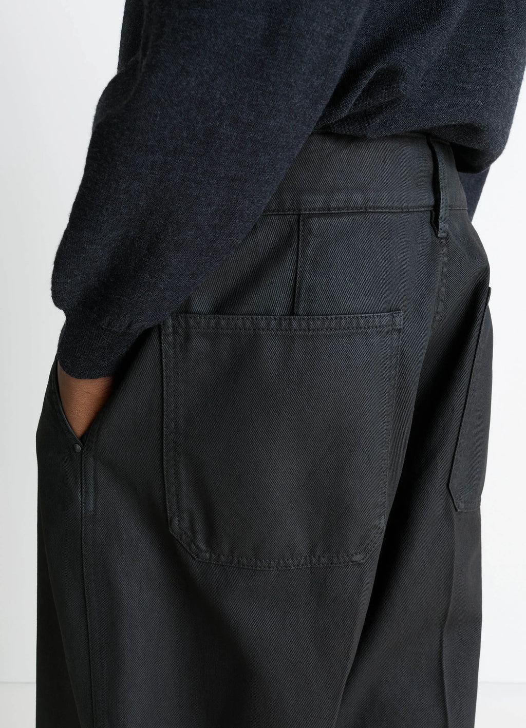 Lemaire Maxi Barrel Workwear Pants in Glossy Coated Denim, model shot, side detail shot back pockets detail