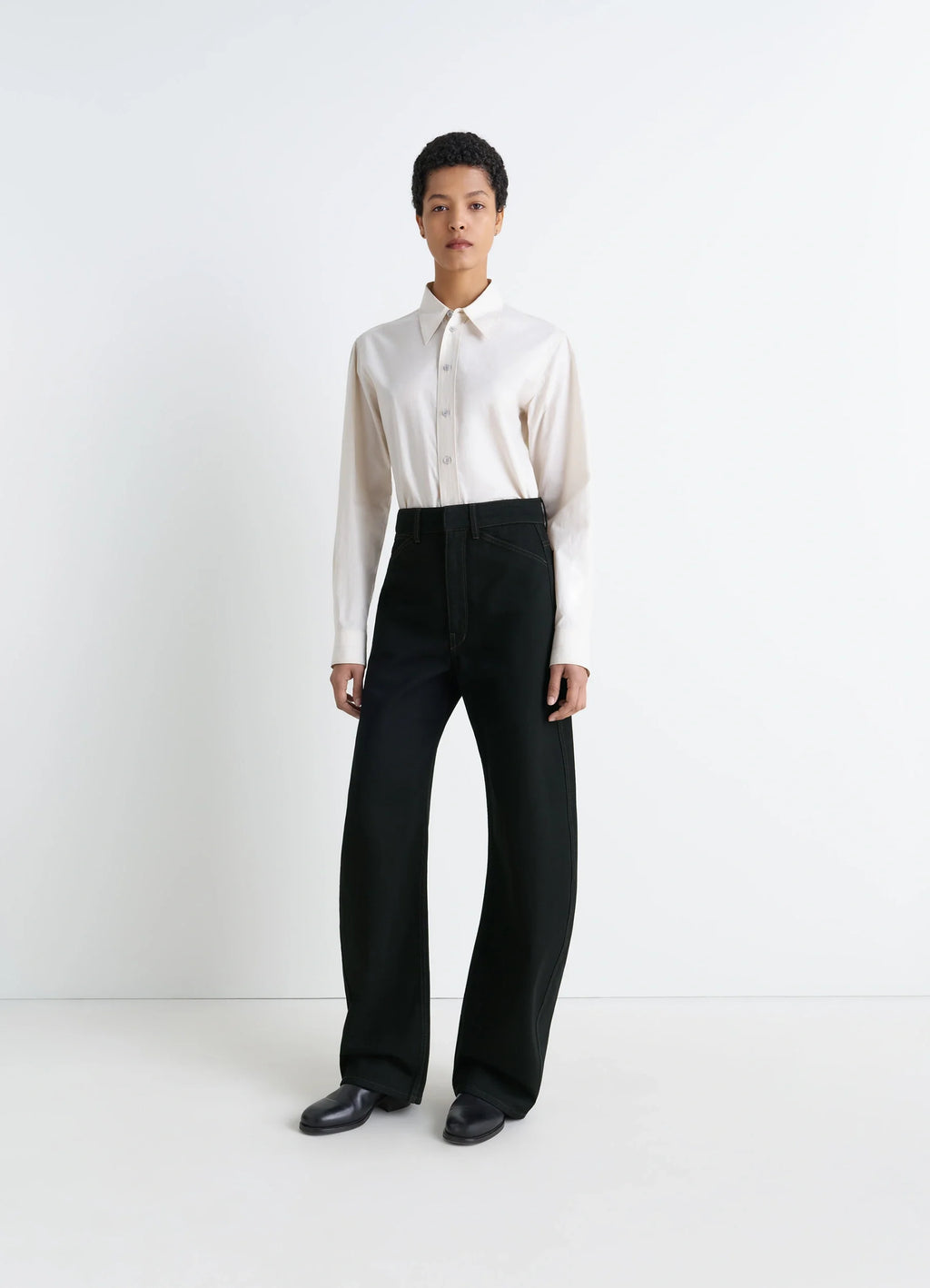 Lemaire High Waisted Curved Pants in Deep Black Thick Denim, model shot, front view rounded cut wide leg