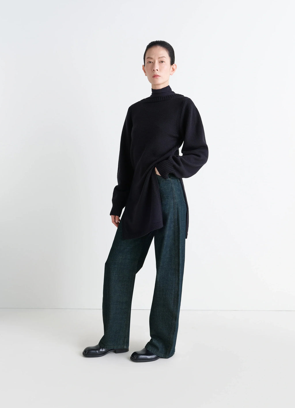 Lemaire High Waisted Curved Pants in Deep Indigo Thick Denim, model shot, front view rounded cut wide leg