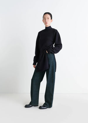 Lemaire High Waisted Curved Pants in Deep Indigo Thick Denim, model shot, front view rounded cut wide leg