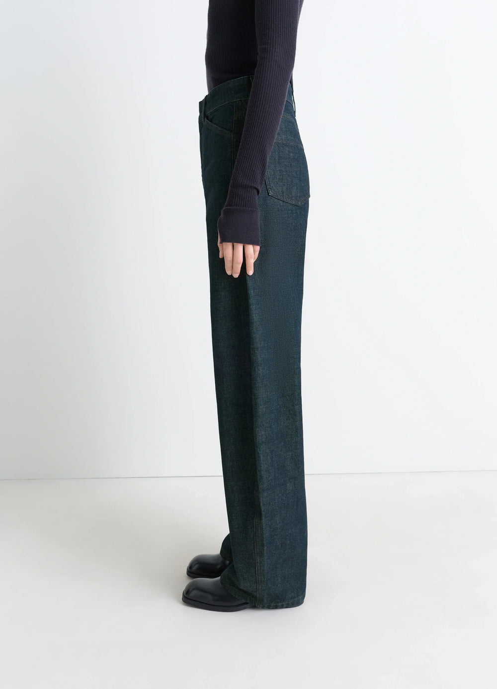 Lemaire High Waisted Curved Pants in Deep Indigo Thick Denim, model shot, side view straight leg cut