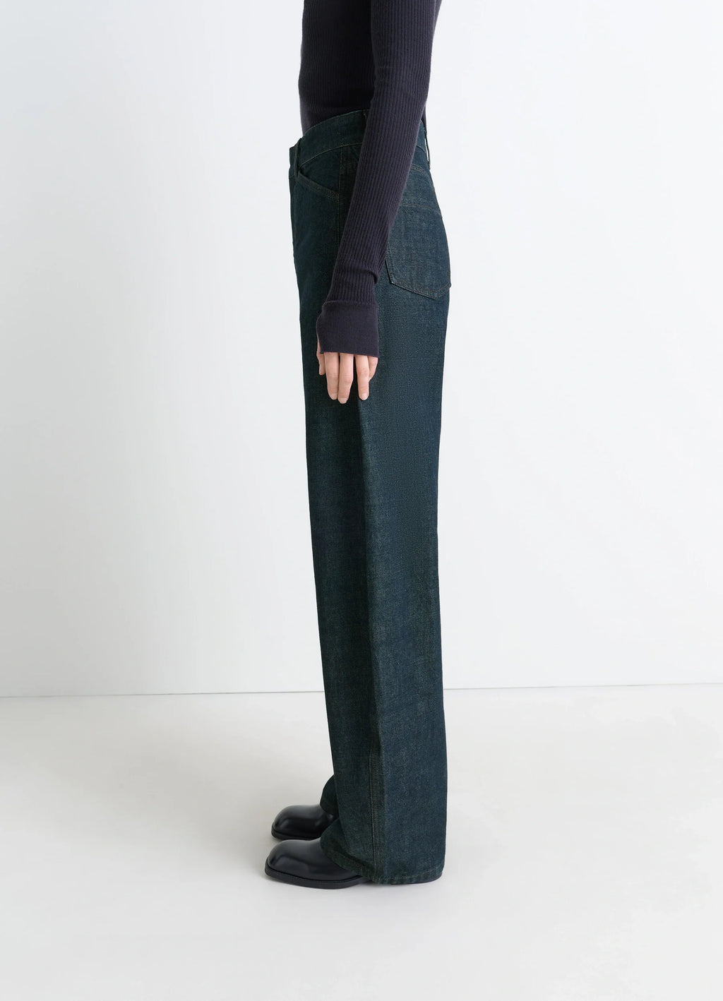 Lemaire High Waisted Curved Pants in Deep Indigo Thick Denim, model shot, side view straight leg cut