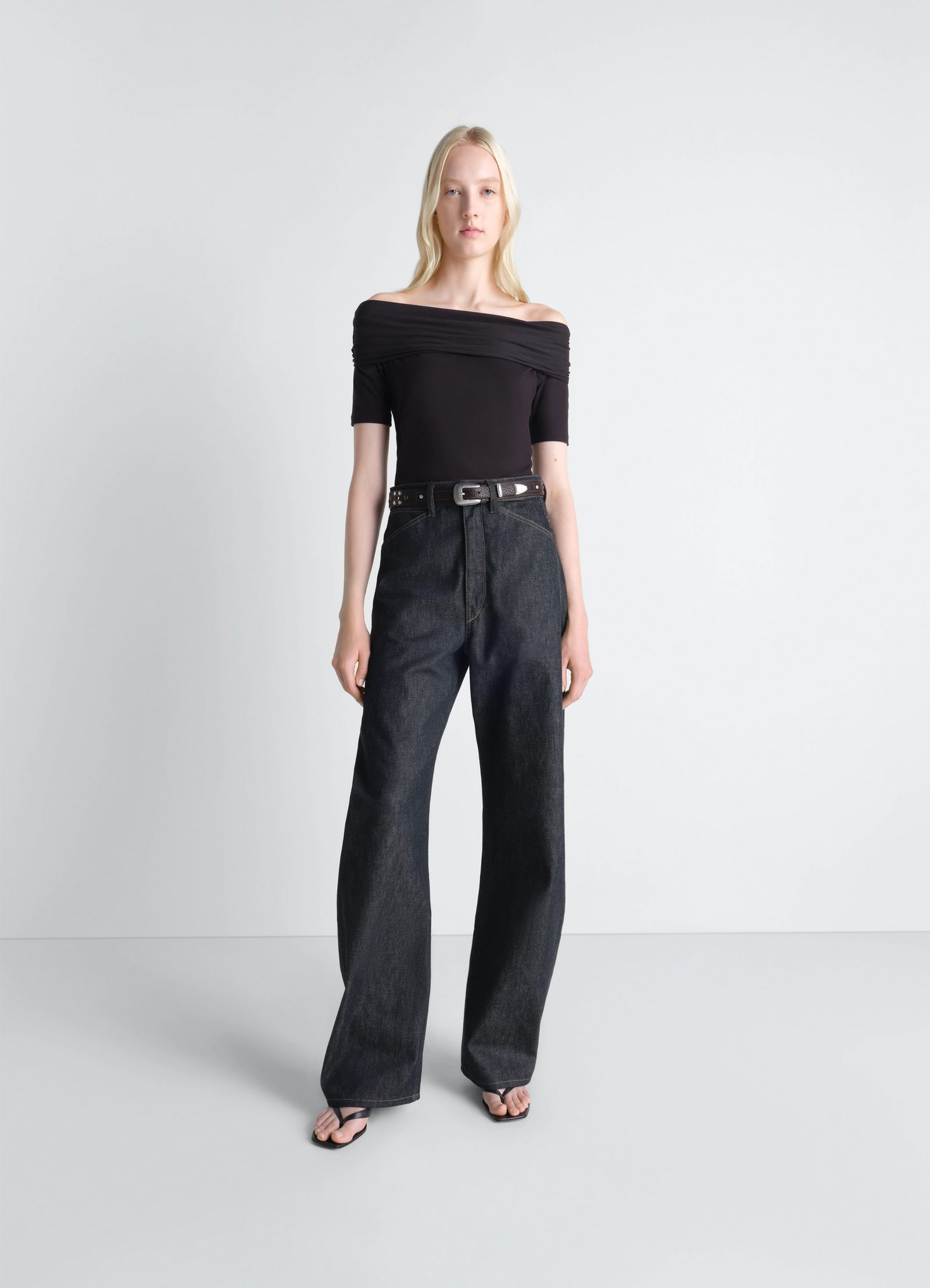 Lemaire high waisted curved pants in slate denim, model shot, front view wide leg