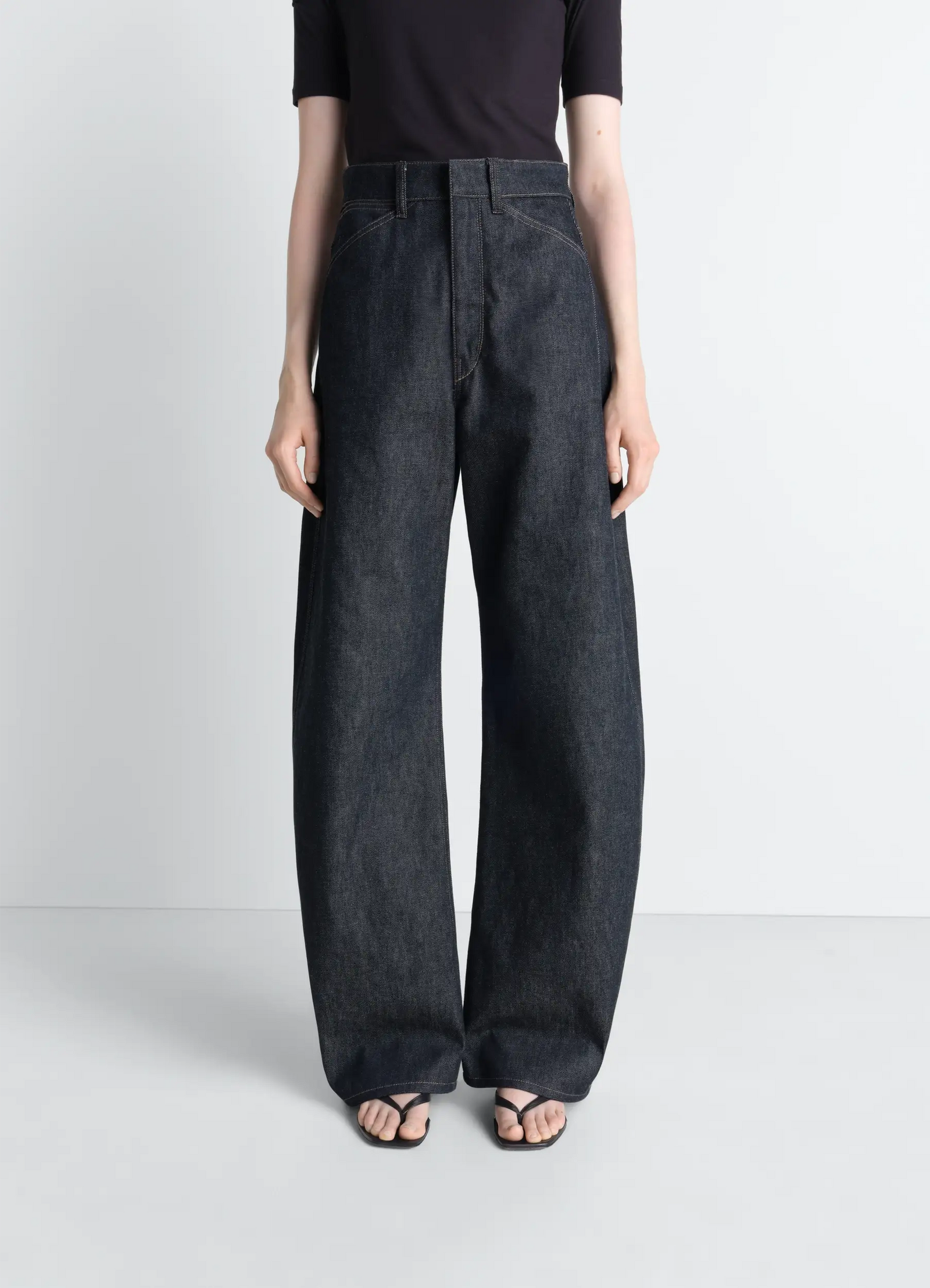 Lemaire high waisted curved pants in slate denim, model shot, front close-up high waist detail