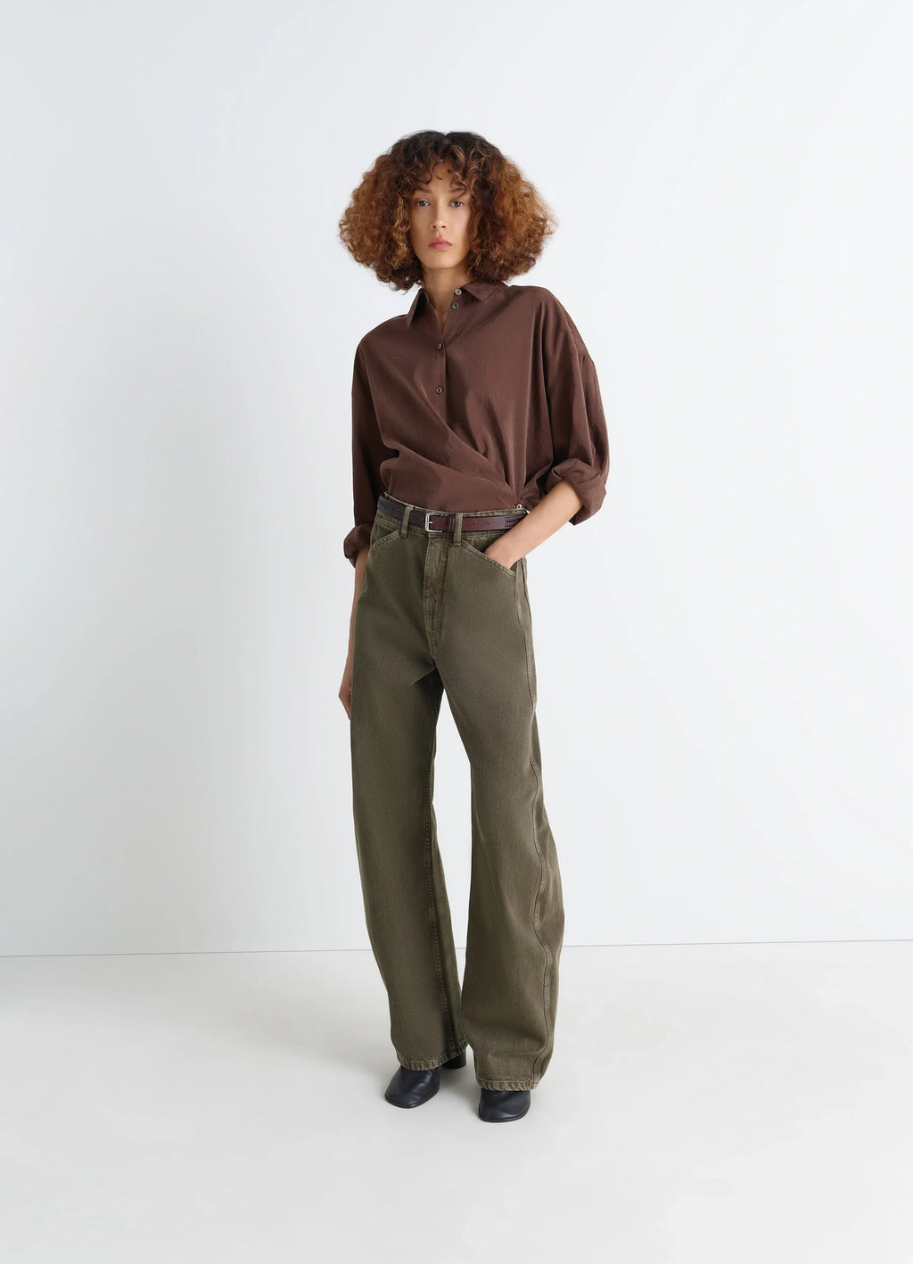 Lemaire High Waisted Curved Pants in Heather Garment Dyed Snow Denim, model shot, front view rounded cut, wide leg