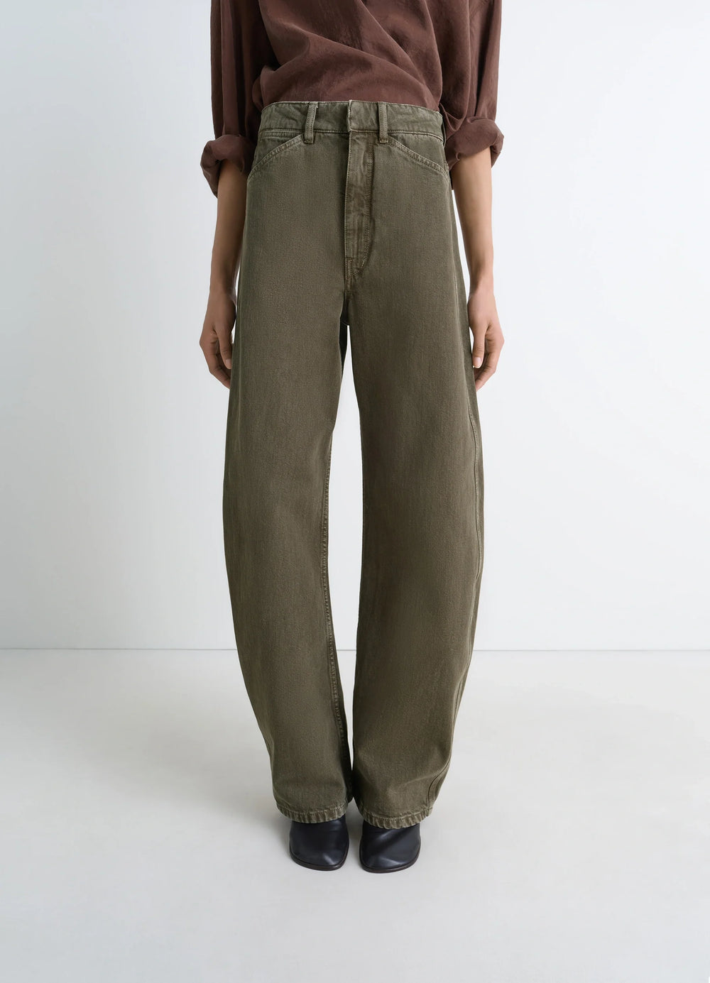 Lemaire High Waisted Curved Pants in Heather Garment Dyed Snow Denim, model shot, partial front view high waist, structured f