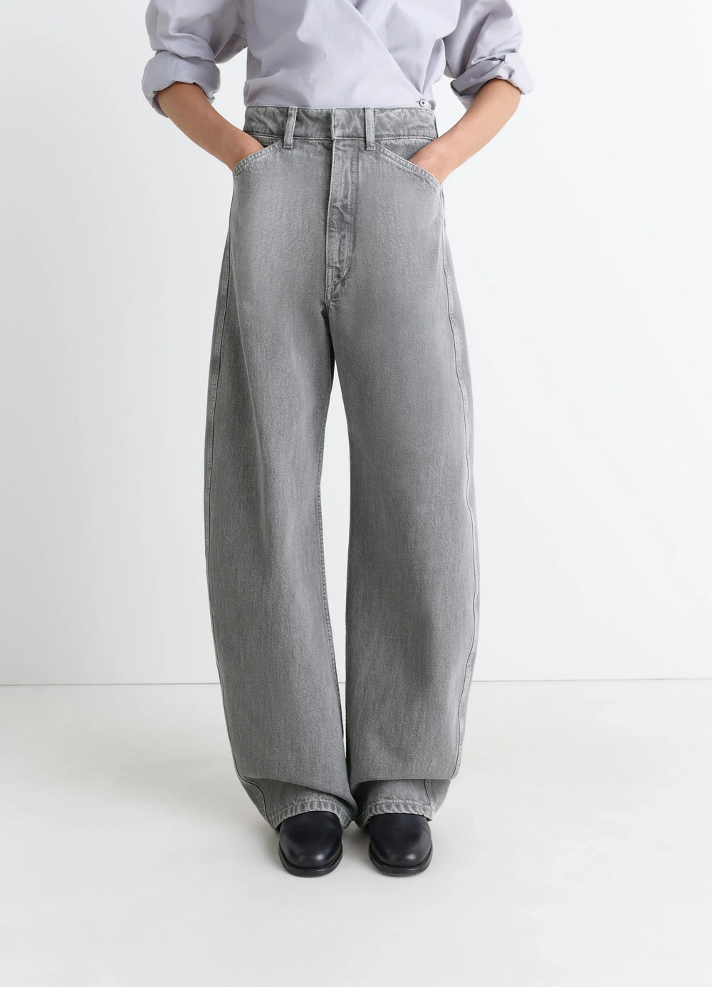 Lemaire High Waisted Curved Pants in Heather Garment Dyed Snow Denim, model shot, close-up view high waist wide leg