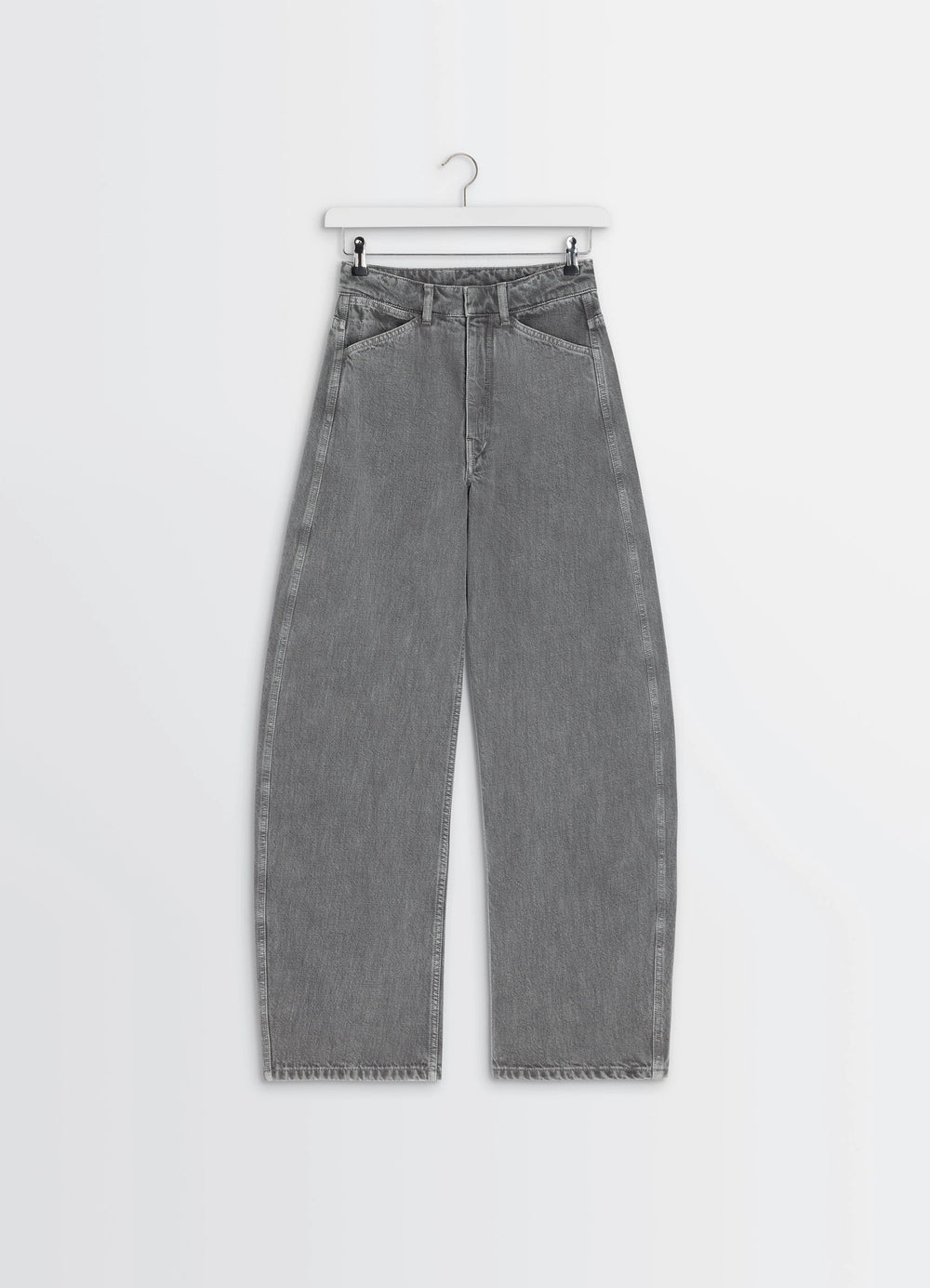 Lemaire High Waisted Curved Pants in Heather Garment Dyed Snow Denim, product shot, angled hanging view high waist with curve