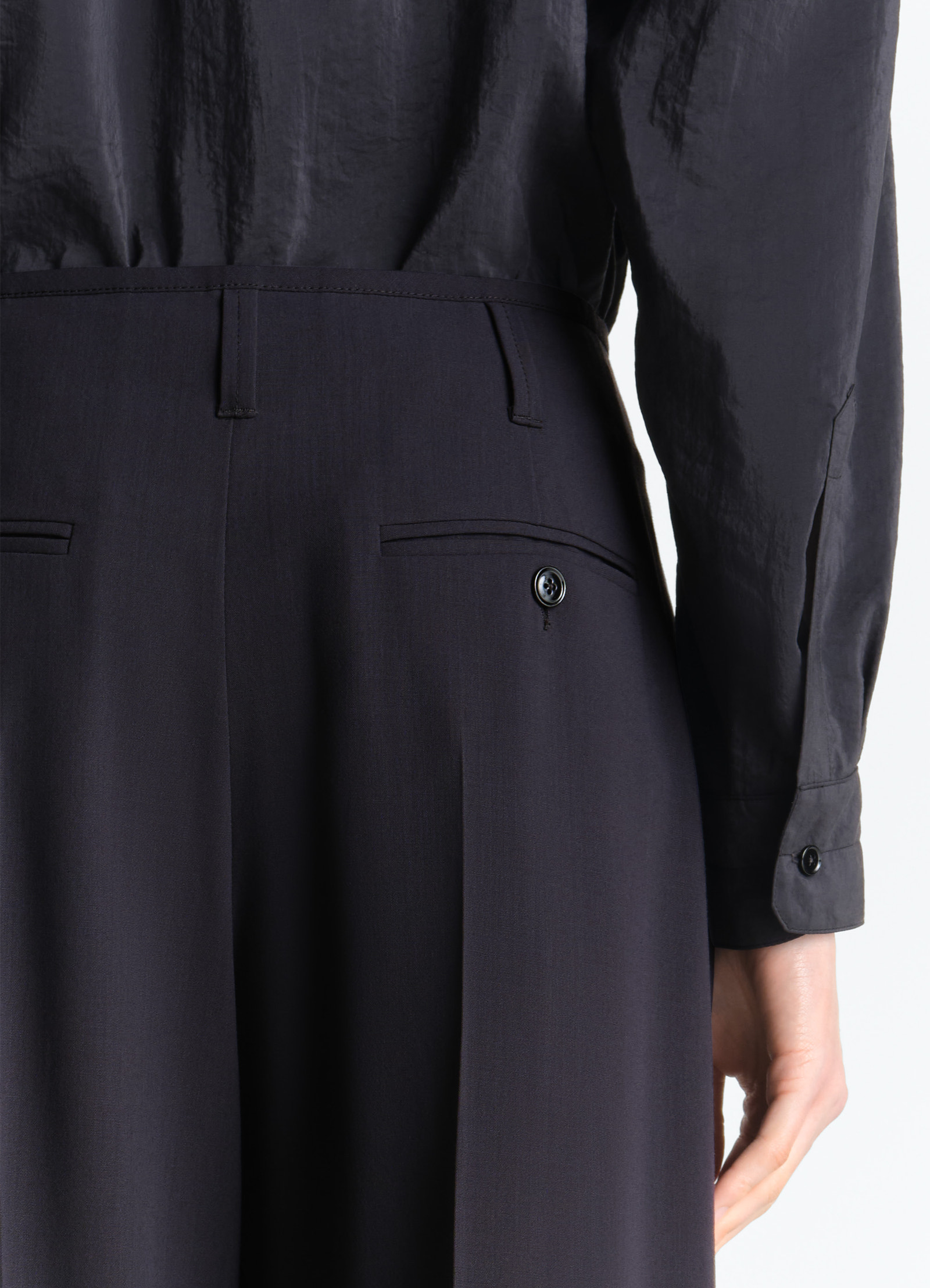 Soft tailored pants in wool crepe, model shot, back waist view button pocket detail